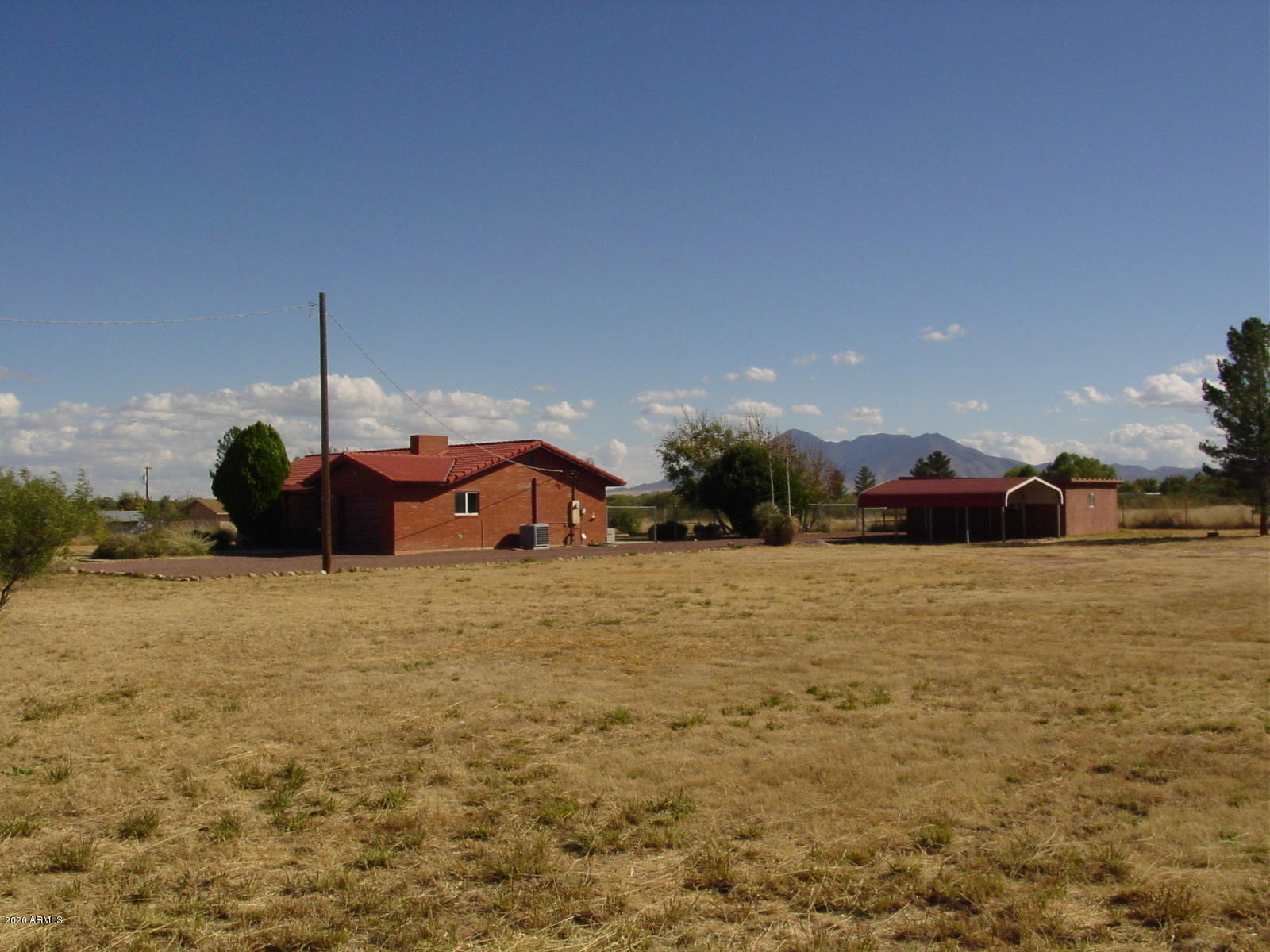 COME SEE THIS HORSE PROPERTY ON 6 ACRES!! IT'S A TRAIL RIDERS DREAM, CLOSE TO THE SAN PEDRO RIVER! Property is located off paved road, has gated access, a private well, and is fenced & cross-fenced. Cute brick home has 2 Bedrooms & 2 Baths, wood burning fireplace and enclosed Arizona room.  Also has a large (500 Sq Ft) heated/cooled building that would be ideal for an office, game room or tack room. 1 car attached garage, plus 2-car carport (great for feed storage). Plenty of room for RV parking. Short distance to San Pedro Riparian National Conservation Area access. Great trails to ride your Horse and to enjoy the beautiful sunsets and awesome mountain views.!