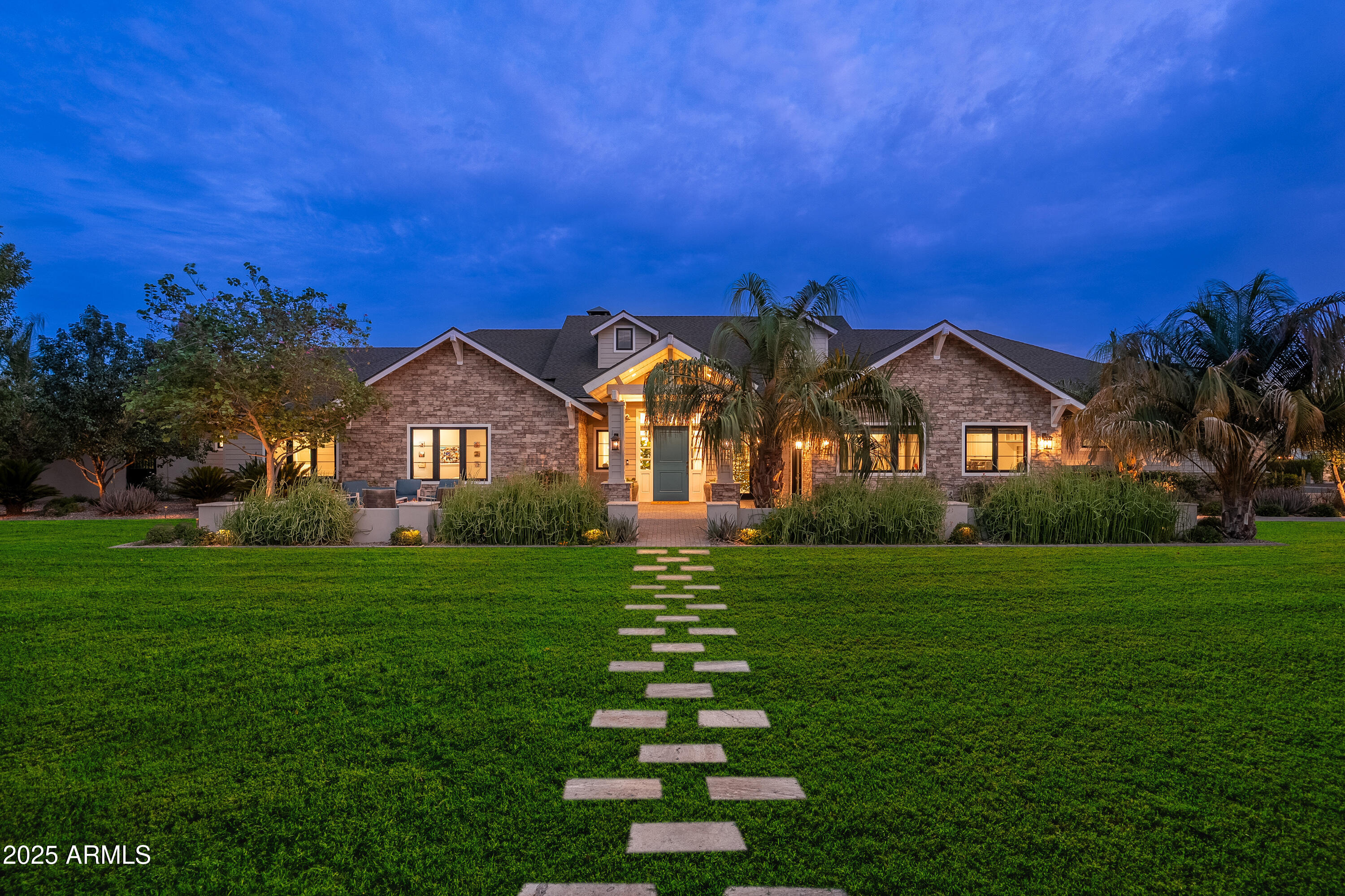 Welcome to this stunning modern ranch-style masterpiece, perfectly situated on a premier corner lot in the highly sought-after Arcadia neighborhood. This ultimate retreat offers 5 en-suite bedrooms, a spacious media room, and a private office with it's own entrance and a custom built-in wall aquarium! Soaring vaulted ceilings, rich wood flooring, a gourmet kitchen with a generous walk-in pantry, and two separate laundry rooms. The backyard is a true entertainer's paradise, featuring a sparkling pool and spa, water slide, expansive covered patio, pickle ball/sport court, fireplace and fire pit - all surrounded by lush professionally designed landscaping. The home features a 4 car garage with an extended bay perfect for storing all of your toys. This home truly has it all.