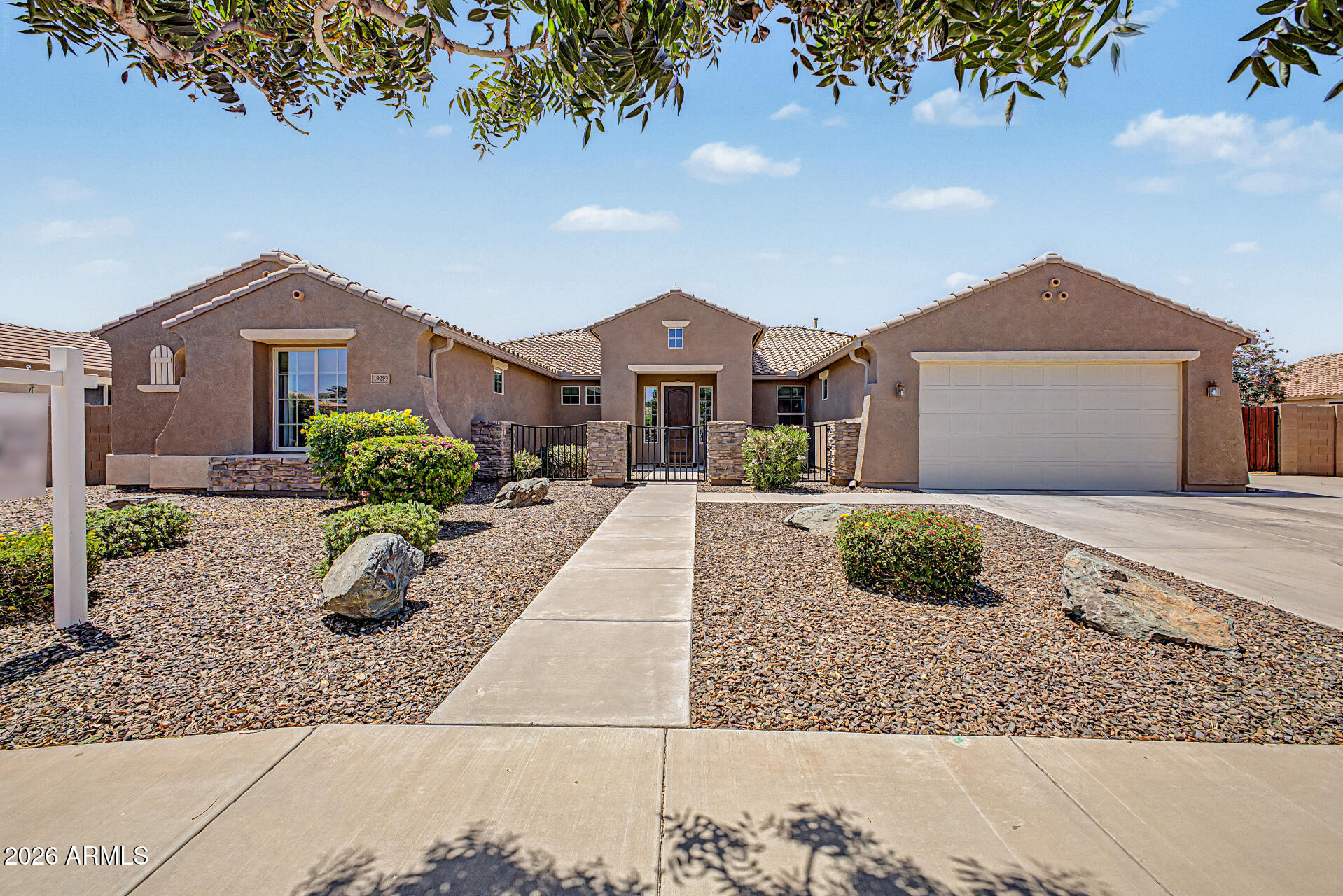 Exceptional Queen Creek living awaits in this beautifully maintained single-level home within walking distance to Mansel Carter Oasis Park. Featuring 4 bedrooms, 3 bathrooms, and 3,393 sq ft, this open-concept floor plan offers soaring ceilings, tile flooring, and a spacious kitchen with granite countertops, large island, walk-in pantry, SS appliances, and abundant cabinetry. The inviting family room features a stunning stone fireplace. The spacious primary suite includes dual vanities, separate tub and shower, and two large walk-in closets. Enjoy Arizona outdoor living with a sparkling private pool, extended paver patio, and built-in firepit. Additional features include a Jack-and-Jill bath, outdoor gas stub, 220 volt hot tub hook up, 50 amp plug for RV, RV gate, and 3-car tandem garage.