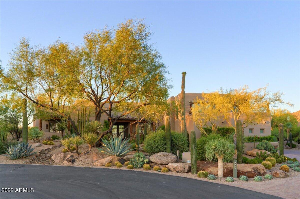 Situated on over 1.3 acres of beautiful Sonoran Desert, this cul-de-sac lot offers the ultimate in privacy! Gated courtyard entry. Greatroom floorplan, private master suite, 3 guest ensuite bedrooms, den, upstairs library and bonus room with sweeping city light & mountain views.     24x24 travertine floors,new interior and exterior paint, stacked stone & more. Gourmet kitchen, designed for the most discerning chef features taj mahal quartzite countertops, knotty alder cabinets and adjacent breakfast room with fireplace. Resort like backyard with beautiful mountain views as a backdrop, pebble tec pool and spa, BBQ cooking station and private putting green all surrounded by spectacular mountain views as a backdrop.  Exquisite landscape design by Trademark Landscaping. Desert Highlands, ranked as a top 100 club by Platinum Clubs of the World, offers world class amenities include a Jack Nicklaus championship golf course, 18-hole putting course, award winning clubhouse featuring Jack's Gastrupub and Jack's Backyard, Highlands Racquet Club offering grass and clay tennis courts + pickleball courts, state of the art fitness center & more. A $95,000 membership fee is due from buyer at close of escrow.