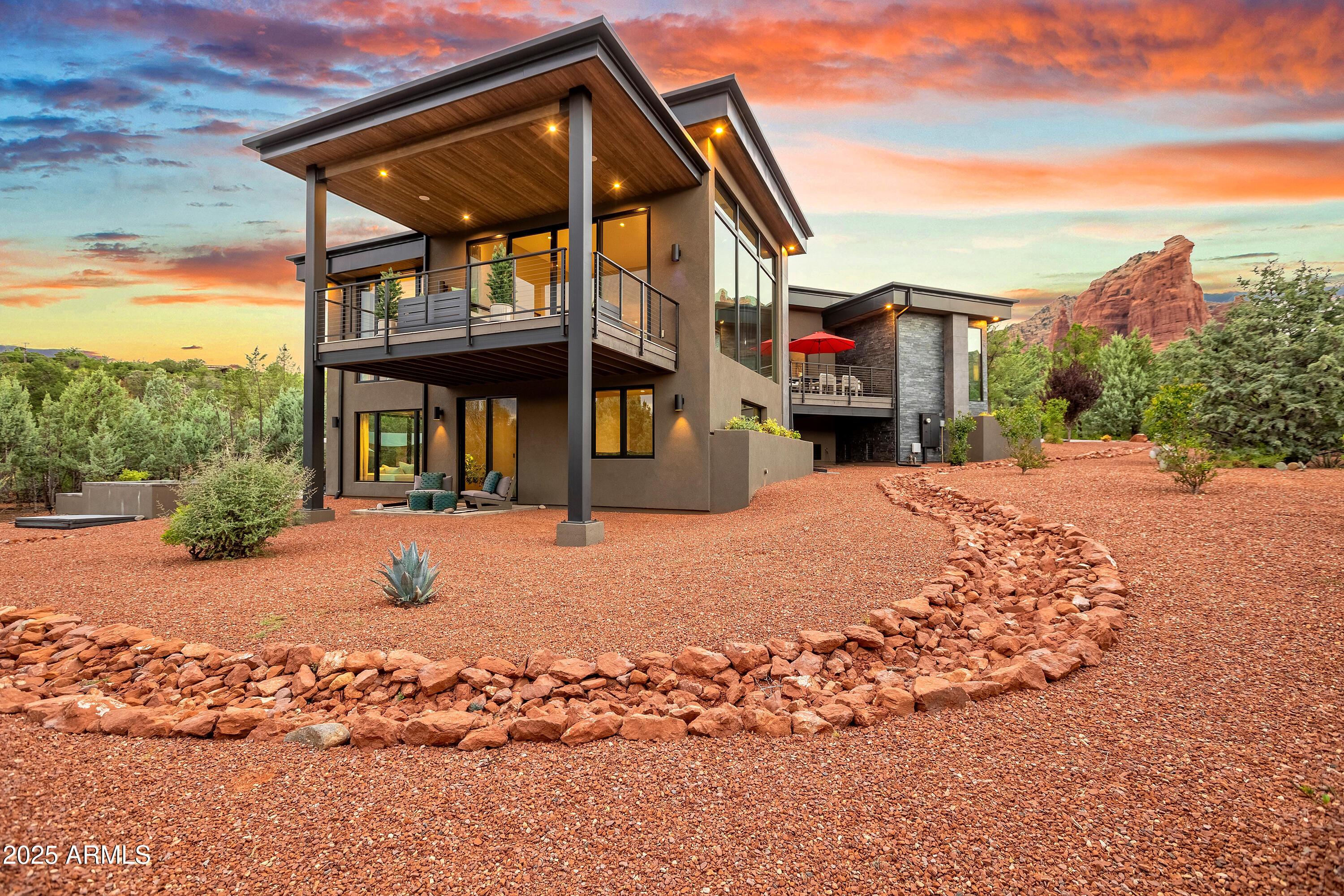 Not just a home-it's a statement. The modern & iconic Sedona smart home you've been waiting for. Panoramic in-your-face views of Mogollon Rim, Saddlerock, Snoopy Rock & beyond. All from the most exclusive neighborhood in town: SOLDIERS PASS. No HOA. No rules. Just freedom & prestige. Live luxuriously and rent it out when you're away: flexibility meets status. All of this & Sedona's finest hiking and biking trails all out your front door. Enjoy a sunset hike up to Sugarloaf Mountain or an afternoon mountain bike ride in Soldiers Wash. The best of Sedona is all at your fingertips. 5 bedrooms (5th used as a study)+ a dedicated fitness room, razor-sharp designer baths & a fully automated smart system that makes the place practically think for you. Architecture? Minimalist:Sophisticated:Sexy Every detail upgraded from the Wide-plank engineered wood floors under your feet, the high end granite and quartz counters with thickened edges and a double waterfall edge in the kitchen, the walnut grain matched cabinetry, floor to ceiling aluminum framed Low E windows, a chef's kitchen that's basically culinary armor featuring Monogram 6-burner gas cooktop + griddle and dual ovens worthy of a Michelin Kitchen. Oh, and a massive butler's pantry and two fully loaded entertainment bars with beverage fridges. And whole home smart lighting, home theater, climate and security  features that make it so easy to customize every detail of your experience. 
Step outside and it's pure desert paradise. Heated saltwater pool. Elevated spa. Outdoor shower that shames five-star resorts. On over an acre of usable land, you've got room for terraced gardens,a greenhouse or that epic firepit gathering spot where nights turn into legends. Got toys? Oversized 2-car garage plus a massive covered RV port with 50-amp power, water, and sewer drop.
The primary suite? Think spa-hotel fusion: Heat & Glo fireplace by the soaking tub, dual shower heads, floating vanity with underlighting, and a closet that deserves its own zip code.
Less than one mile to Whole Foods, the best restaurants in Sedona, and the amenities of Posse Ground Park: 8 Pickleball Courts, Tennis, Bocce, Music Amphitheater, Skateboard Park, Baseball/Softball, and More!
It's bold. It's rare. It's modern Sedona at its finest. And once you walk in, you'll never want to leave.