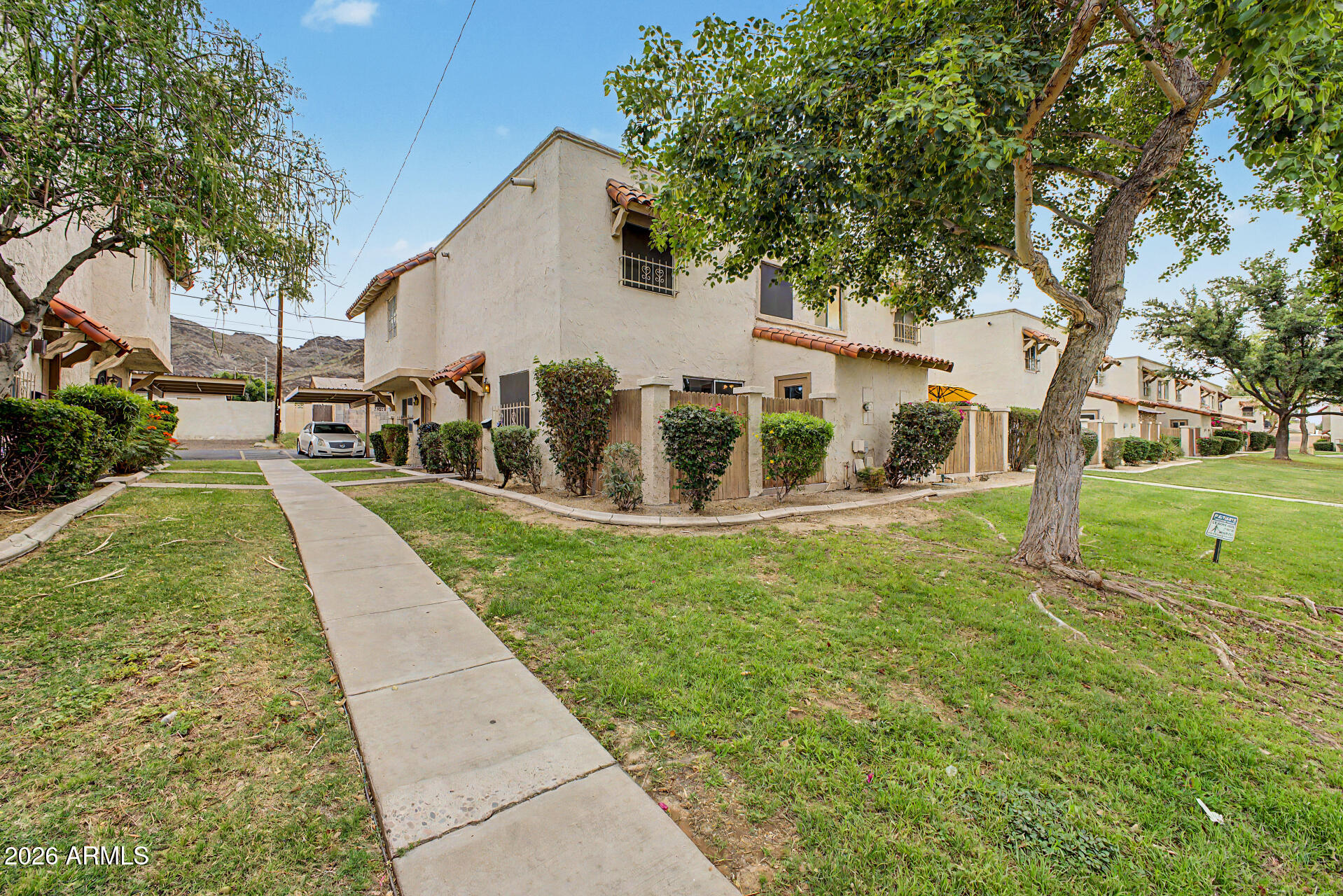 Corner-unit 2-story condo in a quiet, established community! 2Br/1.5Ba, 924sf, with all appliances included. Updates: interior paint (2026), professionally cleaned carpets, newer fridge (1.5 yrs) & dishwasher (3 yrs). Private enclosed patio with dedicated laundry room. Near community pool, BBQ gazebo & mountain views. HOA maintains roof/exterior, water, sewer, garbage collection, front yard & common areas for low-maintenance living. Assigned covered parking + low HOA. Close to parks, hiking/biking in Phoenix Mountain Preserve, dining, freeways, downtown, top rating Sunnyslope High School, and local amenities. Exceptional value!