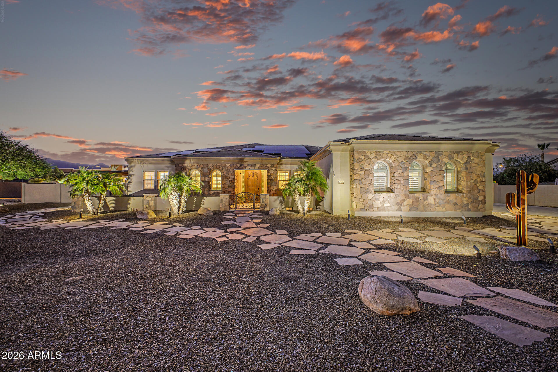 Welcome to your DREAM home! Nestled on a 1.04-acre lot, this stunning custom home offers breathtaking sunrises & sunsets, along with a host of high-end amenities that elevate everyday living. Great curb appeal with a circular driveway, stone accent details, & a large front porch. Attention to detail is shown in the elegant interior! Featuring high ceilings, tons of natural light, wood shutters, and a designer palette with wood-look & tile flooring throughout. You'll love the open floorplan showcasing spacious great room with surround sound, and quadruple slider to the expansive backyard - allowing a greater traffic flow for entertaining.
The gourmet kitchen is a chef's delight! Boasting premium SS appliances w/5-burner cooktop, granite counters, a plethora of custom cabinetry, recessed & pendant lighting, a walk-in pantry, and an oversized island w/breakfast bar. The bonus room, with stylish barn door, is located between two secondary bedrooms - useable as a den or second living space with direct access to a private covered patio. Split bedroom floor plan for added privacy! The owner's suite showcases outdoor access and a spa-like bathroom with dual sinks, a soaking tub, a separate snail shower, & a walk-in closet. Two of three secondary bedrooms have their own private bathrooms & walk-in closets, (one has a murphy bed, which conveys) while the other bedroom (currently used as a den) has a slide closet. Venture outside to your own RESORT-STYLE backyard oasis! Enjoy a covered patio with outdoor fireplace, separate pergola with built-in BBQ and table top seating with a fire trough, expansive patio area leading to the focal point of this gorgeous backyard - the sparkling pool and spa! Another pergola and fire pit round out this entertainer's dream! All patio furniture conveys! Perfectly nestled amidst picturesque mountain views, creating a serene backdrop for everyday living. Home has OWNED SOLAR PANELS, a 3-car garage, RV gate & parking, and extended driveway. What's not to like? This gem is a rare find!  Take a look today!