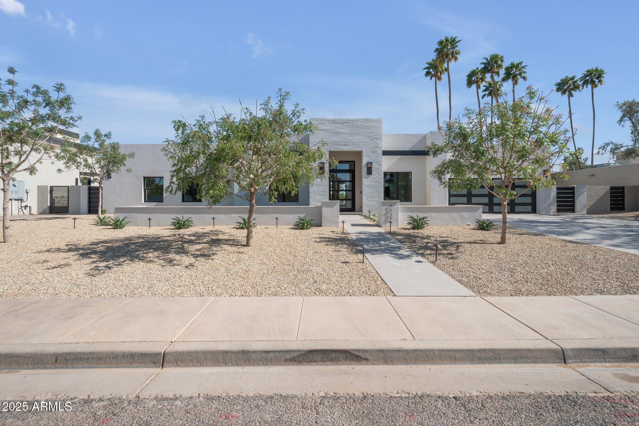 Modern renovation on McCormick Ranch Golf Course. 180-degree golf & Camelback Mountain views from the beautifully sited 12,900 sq ft lot. Intentionally designed for natural light & bright living spaces in its 4 bedrooms, 4 baths, & a den/office. Thoughtfully finished by Dettaglio Interior Design, light wood floors meet modern lighting, two-tone custom cabinetry with quartzite counters, a live-edge walnut island overhang, Wolf range, dual Sub-Zero refrigerators, & a dry beverage bar & prep sink. Guest suite has sliders to the rear yard, a private side entrance, & washer/dryer hookup. Master suite features a cozy secondary ''hers'' shoe, & handbag closet. 10′ & 12′ ceilings throughout the public spaces of the home. Property is complete with an outdoor kitchen & A/V/security, incl