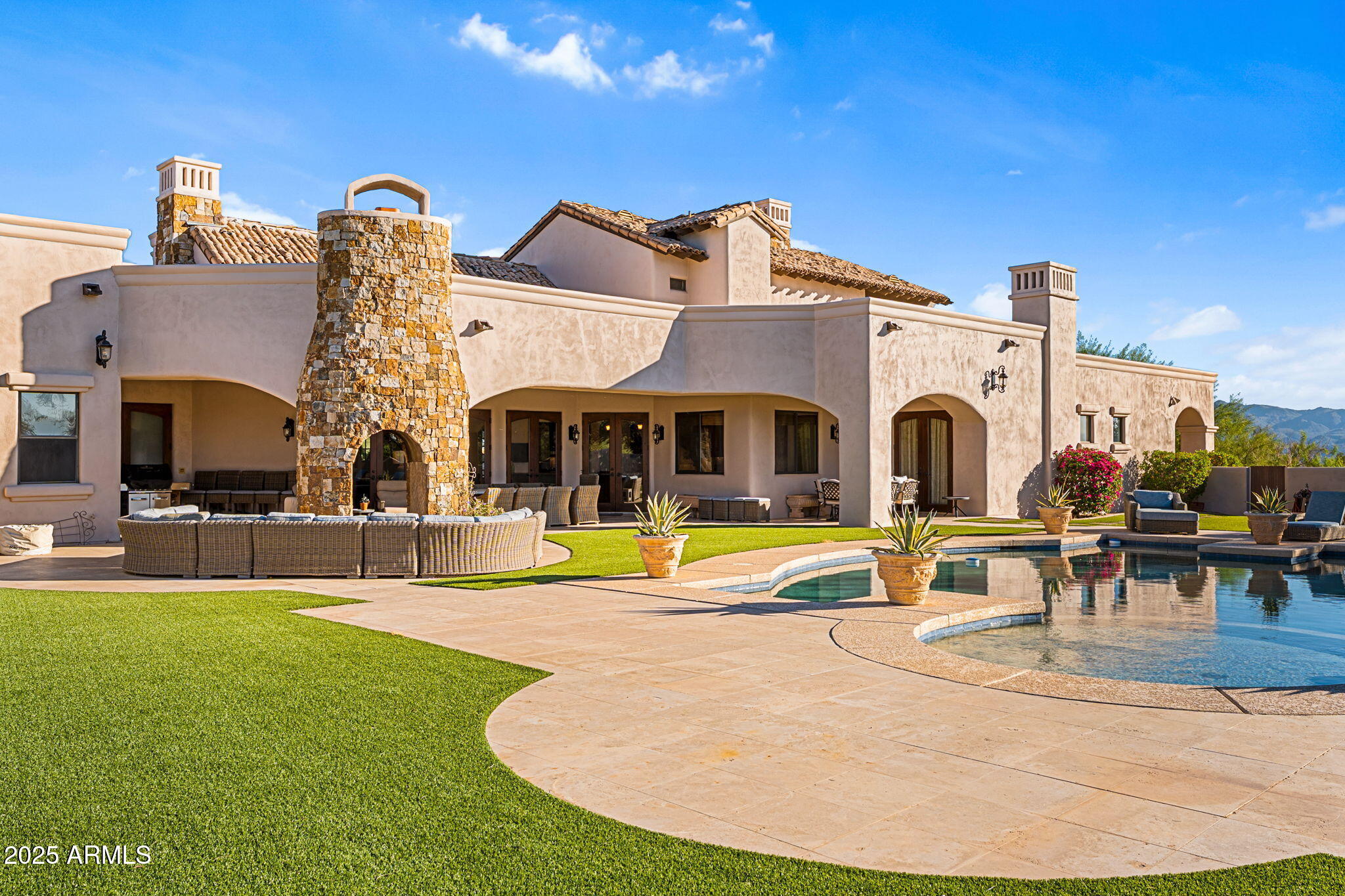 Welcome to an equestrian paradise nestled on 23 private acres with direct access to McDowell Mountain Park's endless trails. This Tuscan-inspired estate offers a refined living space featuring vaulted ceilings, intricate craftsmanship, and premium finishes throughout.

The chef's kitchen is a true showpiece — complete with high-end appliances, a large center island, and ample bar seating for entertaining. The resort-style backyard is an entertainer's dream, featuring a grand pool, spacious covered patio, and a dramatic outdoor fireplace — all perfectly framed by panoramic views and Arizona's legendary sunsets.
Two additional parcels are included for a total of 23 acres. Equestrian amenities include a custom 10 stall barn with oversized stalls with large turnouts, automatic waters, a spacious tack room, and a designated farrier/saddling area. There is adequate room to exercise or train your horses in the 140'x260' arena or turn them out for relaxation in one of the four oversized 70'x280' shaded turnouts with water.

Enjoy the serenity of rural living while still being minutes from Scottsdale's upscale conveniences. This is luxury desert living at its finest  where elegance meets equestrian excellence.