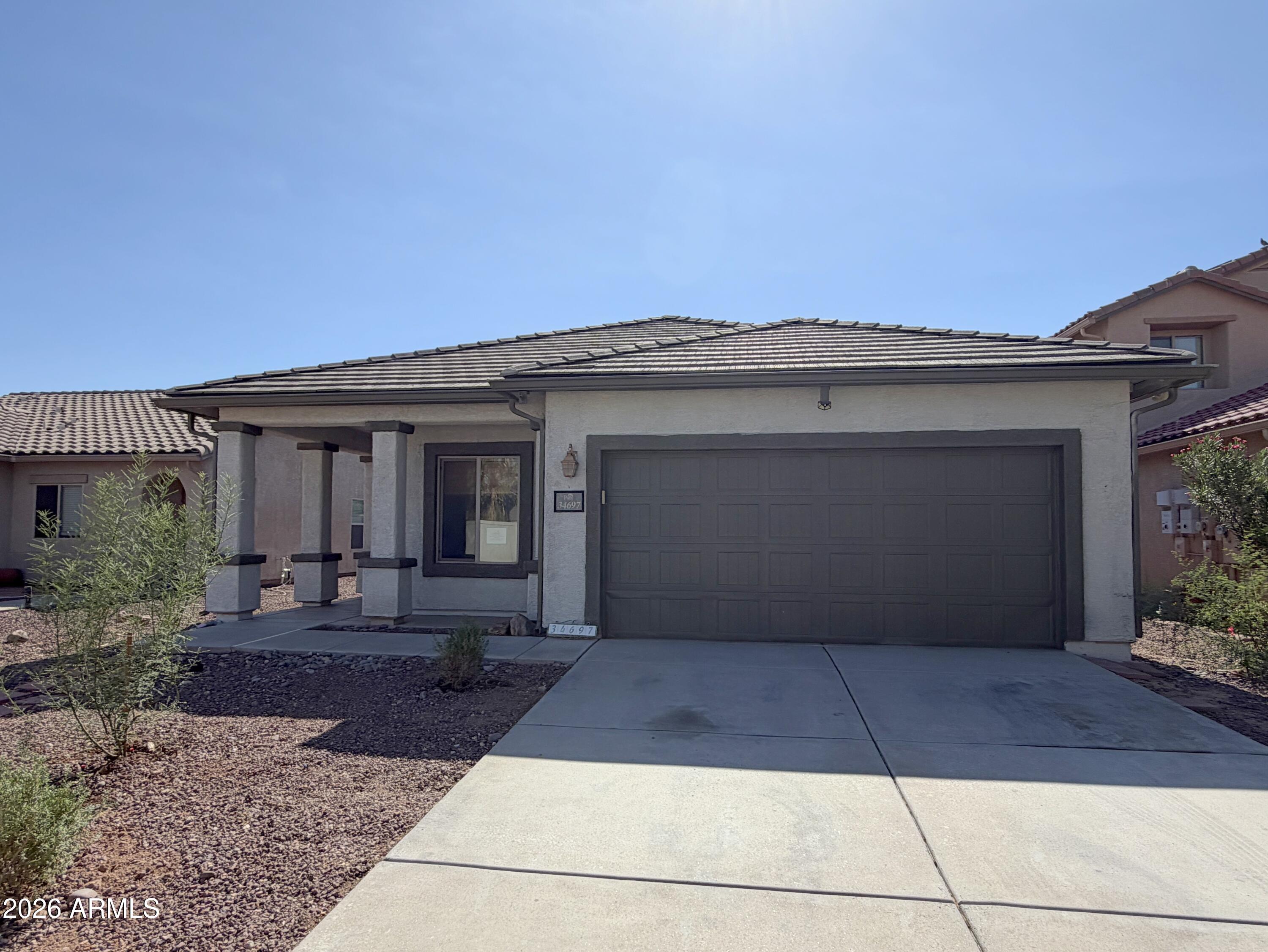 Welcome to this spacious 4-bedroom, 2-bathroom home in Red Rock! Offering 1,777 square feet of comfortable living space, this home features ceramic tile flooring, a large kitchen with tons of cabinet and storage space, and stainless steel appliances. The open and functional layout provides plenty of room for everyday living and entertaining. A 2-car garage adds convenience and additional storage. Outside, enjoy a large backyard with plenty of room for entertaining, play, gardening, or creating your own outdoor retreat. The front yard has been refreshed with new plants, adding to the home's curb appeal. This home offers space, functionality, and plenty of potential in a great Red Rock location.