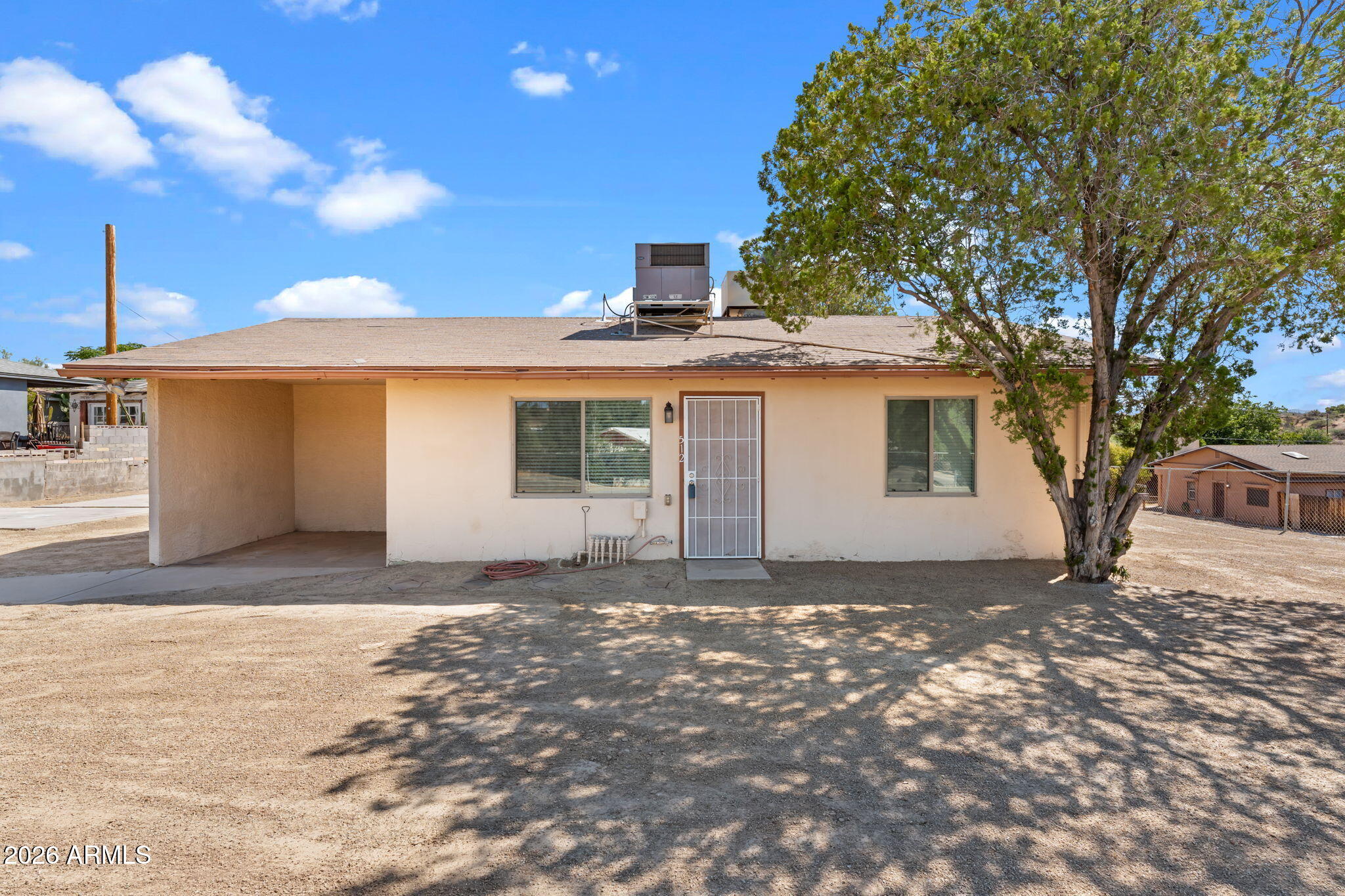 Welcome home to this super clean and charming 2-bedroom, 1-bath home nestled in the heart of Wickenburg! Situated on an elevated corner lot, this inviting property also offers spacious fully fenced front and back yards - perfect for gardening, entertaining, pets, or creating your own outdoor retreat. Inside, you'll find a bright, well-maintained interior with recent updates that include fresh interior paint, new carpeting, new blinds and an updated bathroom, making this home truly move-in ready. Whether you're looking for your first home, a winter getaway, or an investment opportunity, this property offers comfort, character, and an unbeatable location just minutes from Wickenburg's historic downtown, shopping, dining, and local events.
