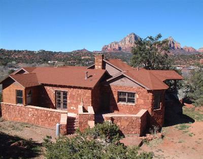 Historic Landmark Residence Approved For 15-room B&B/Inn, 4 artist studios, 3 Residences. Would Also Make An Incredible Home, Residential Compound or condos (per City of Sedona staff). Borders National Wilderness Land with 180-degree unblockable views! Not much land like this left...close to town yet borders National Wilderness, rolling topography, incredible views with as many potential uses as this...Zoned Transitional!