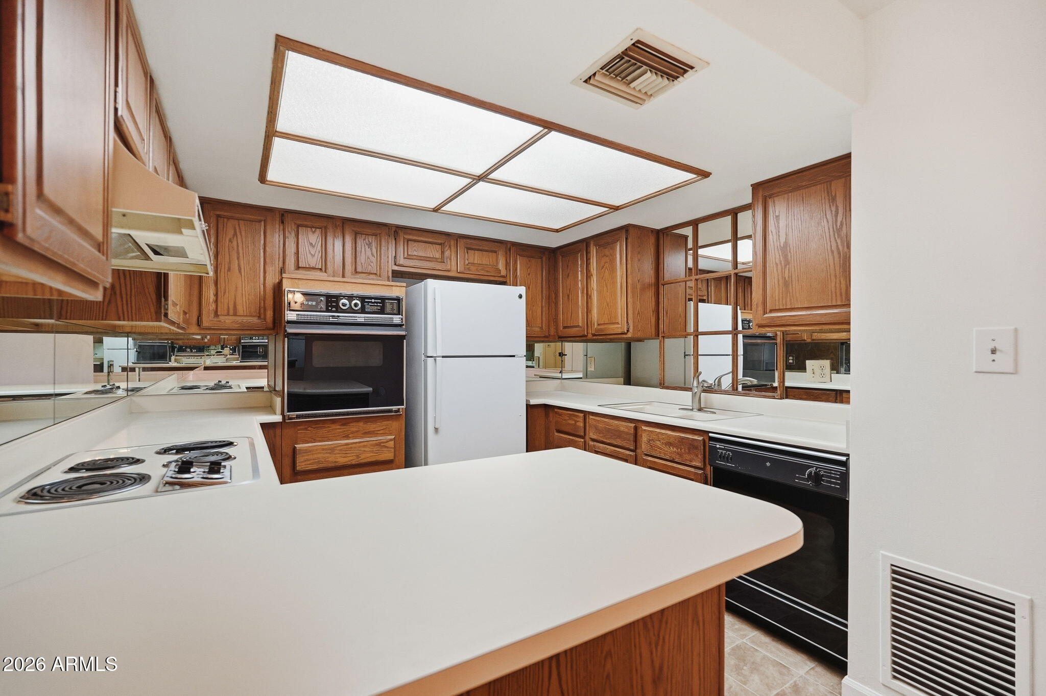 Rare opportunity to own one of the few casitas available in the highly sought-after Heritage Park Retirement Community! This beautifully maintained patio home is ideally located on the ground floor near the entrance, offering direct access to the heated pool and spa, no upstairs neighbor, & convenient access to community amenities. Inside, you'll find an eat-in kitchen w/ breakfast bar, wall oven, & generous counter space. The bright living room opens to a private patio through large sliding glass doors. The spacious primary suite features a walk-in closet, double vanity, full bath, w/ patio access. Enjoy storage room with washer/dryer. Community amenities include fitness center, media room, library, putting green, concierge services, communal dining, & gated parking. This is A MUST SEE!!!