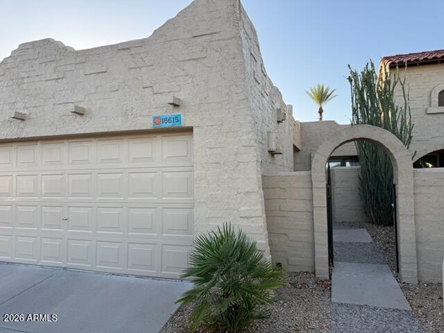 Welcome to this beautifully updated 3-bedroom, 2-bath townhome located in the desirable gated Mission Square community. Featuring soaring vaulted ceilings and an open-concept floor plan, this home offers a spacious and inviting atmosphere from the moment you enter. The remodeled kitchen showcases upgraded cabinetry, granite countertops, and modern finishes, while the updated bathrooms provide a stylish and comfortable retreat. Neutral tile flooring throughout adds durability and timeless appeal. Enjoy Arizona evenings on the private covered patio with no direct rear neighbors, creating a peaceful outdoor setting. Residents have access to a sparkling community pool, lush common areas, and the security of a gated neighborhood. Conveniently located near shopping, dining, entertainment, and easy access to both I-17 and Loop 101, this move-in-ready home combines comfort, convenience, and low-maintenance living.