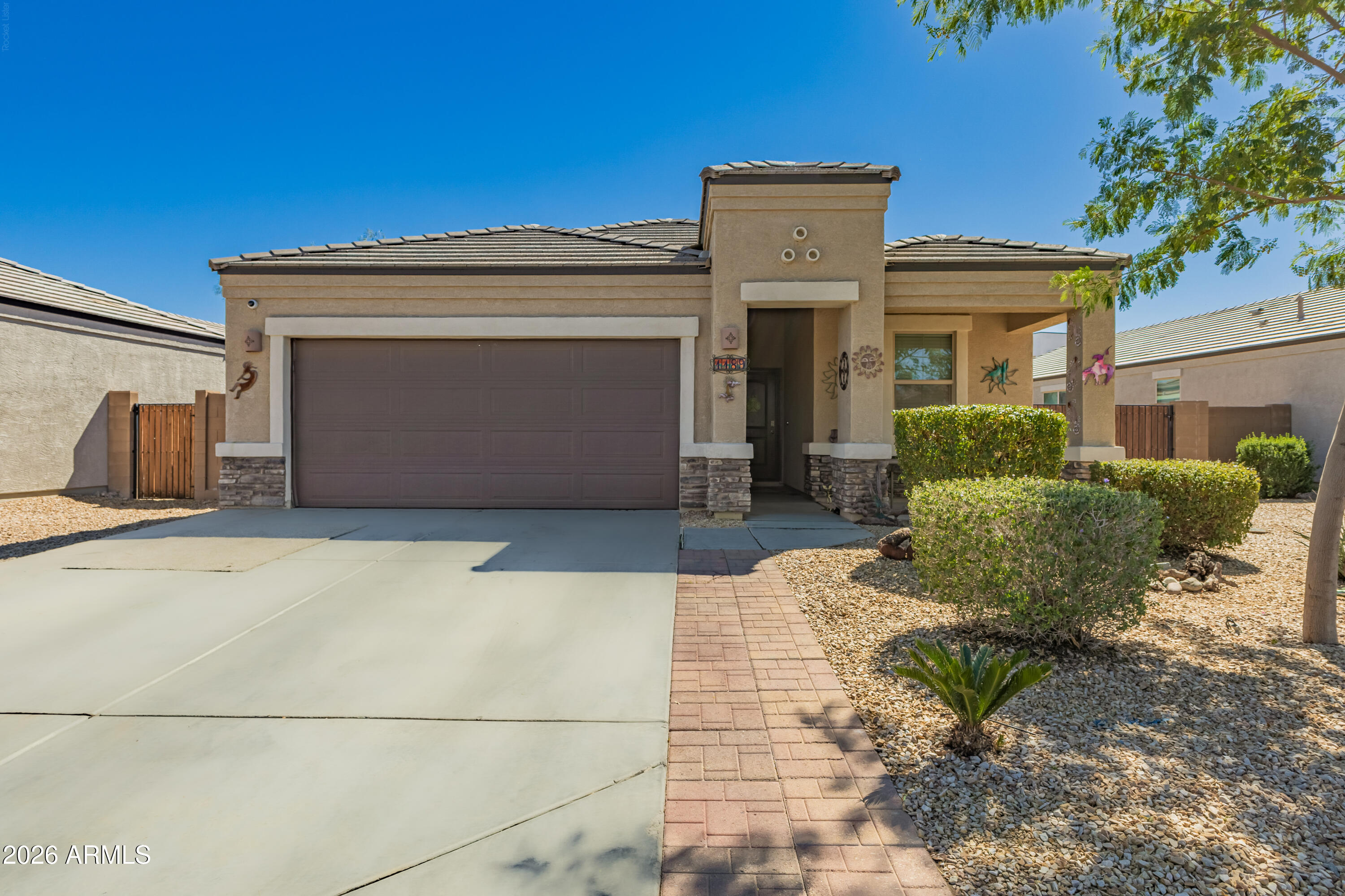 Welcome to this adorable 3-bed, 2-bath home in Cottonwood Ranch! Its charm starts with stone accent details, front porch, manicured landscape, RV gate & parking, and a 2-car garage. The inviting interior showcases abundant natural light, a neutral palette, tile flooring in common areas, and soft carpet in bedrooms. Designed for everyday living & entertaining, you'll love the seamlessly flowing open layout! The open-concept kitchen boasts SS appliances, granite counters, a pantry, designer backsplash, ample espresso cabinetry, and an island w/breakfast bar. The primary bedroom has an ensuite with dual sinks & a walk-in closet. Check out the large backyard with a covered patio & artificial turf, where you can relax or enjoy BBQ! Don't miss this opportunity!