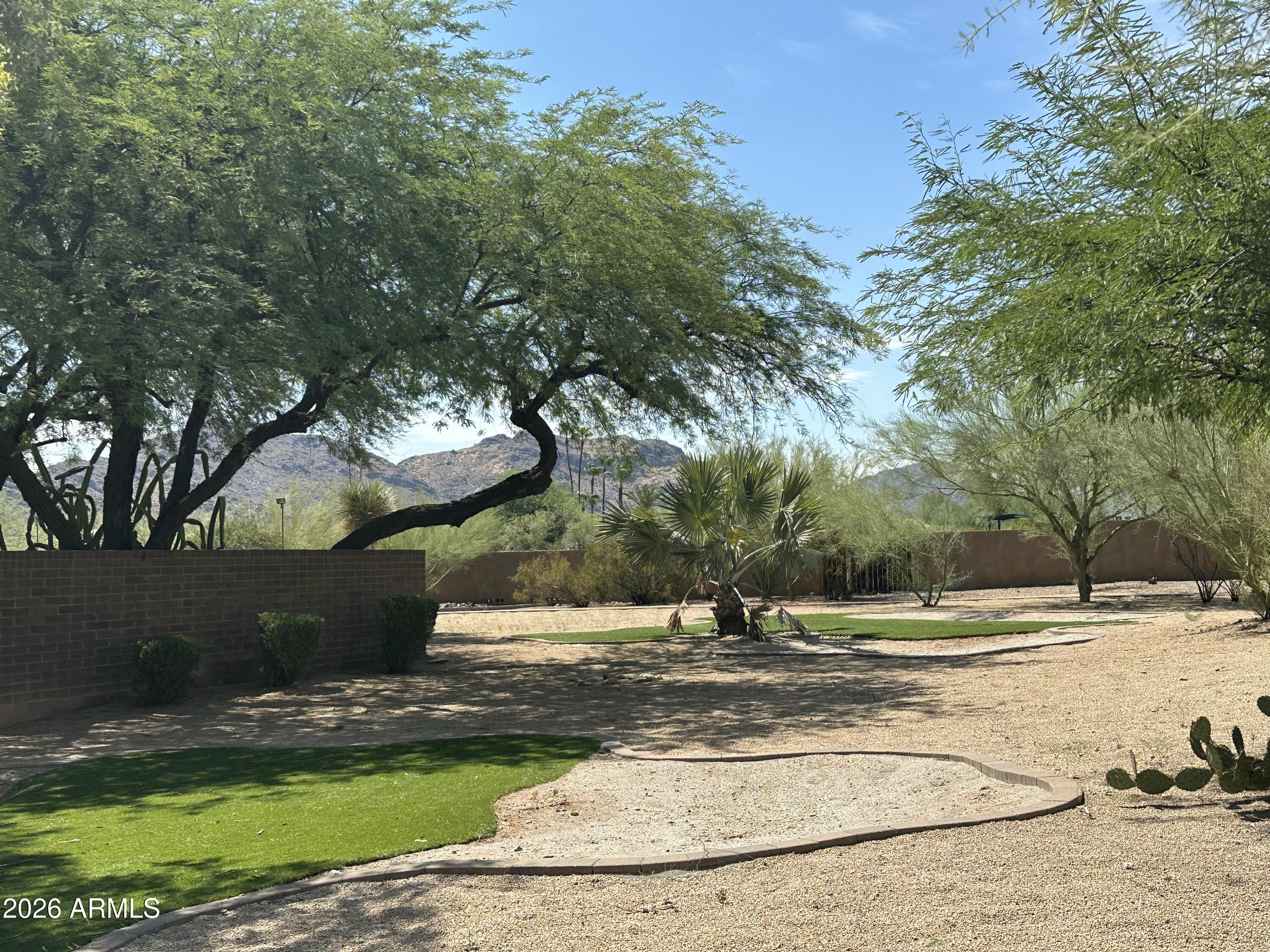 This stately property has incredible views of Camelback Mountain and Mummy Mountain from the back, Mummy Mountain and the Phoenix Mountain Preserve views from the side, and McDowell Mountain views from the front.  This gated 2.33 acre estate is flat and an incredible opportunity to build!  This will sell fast!