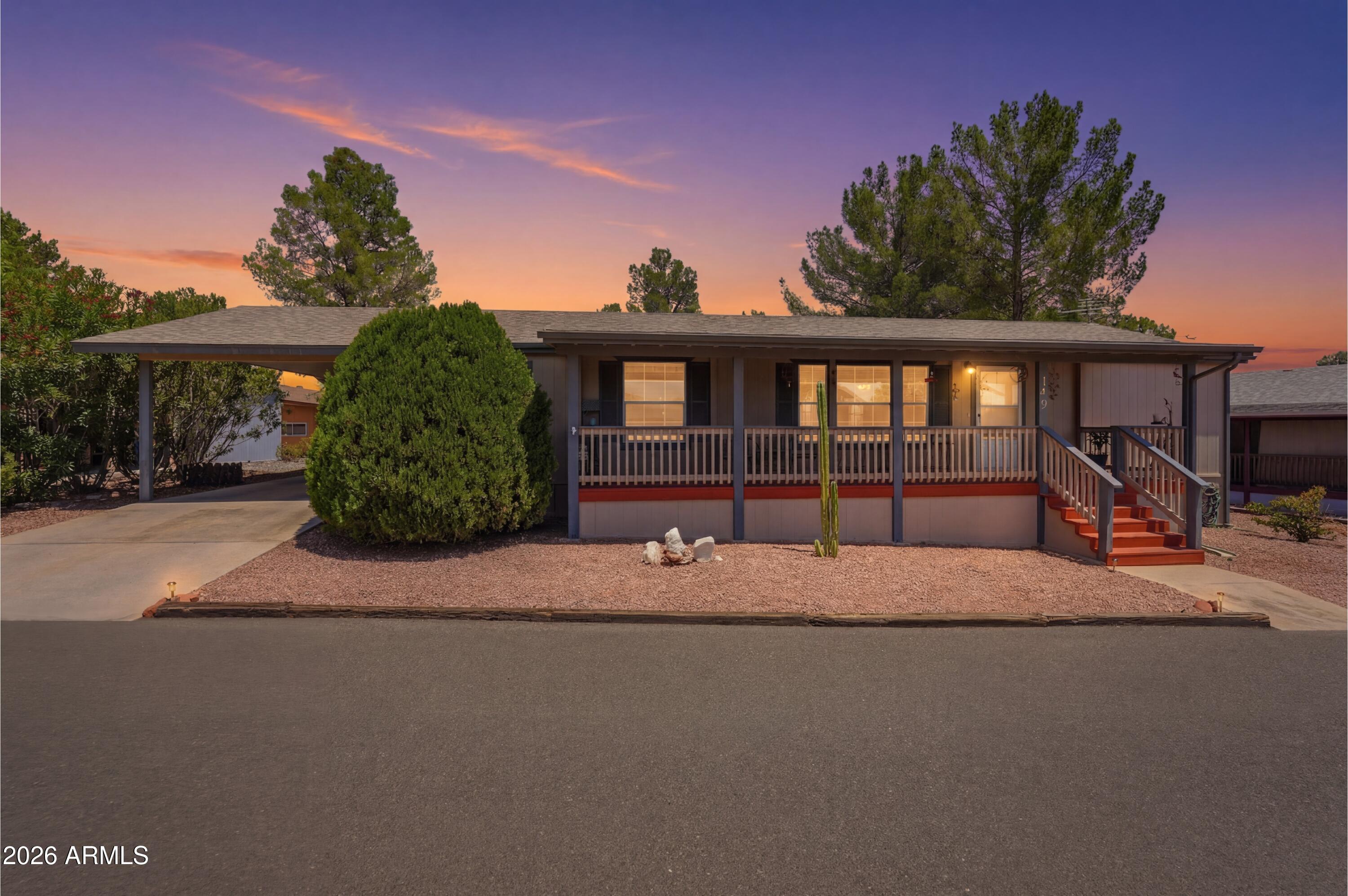 The attentively well kept 2001 manufactured home is located in the Pine Shadows mobile home park on leased land. This lovely property has tremendous Mingus mountain views from the covered front porch and a layout that is truly modern and functional. This approximately 1560 sf home has been lovingly updated. HVAC new in 2023, water heater new in 2024. Durable vinyl flooring was installed in 2025, along with a new gas range, new vent hood, new dishwasher and a new bathroom vanity making this a convenient move-in-ready home. The split bedroom floor plan gives the primary suite added privacy. There is a den off the primary suite that can be an office or craft room. The indoor laundry room has storage cabinets and is adjacent the 3-car tandem carport and a large outdoor workshop w/ electricity The community has high end amenities, an indoor pool, pickle ball courts and maintains vibrant activity calendar.