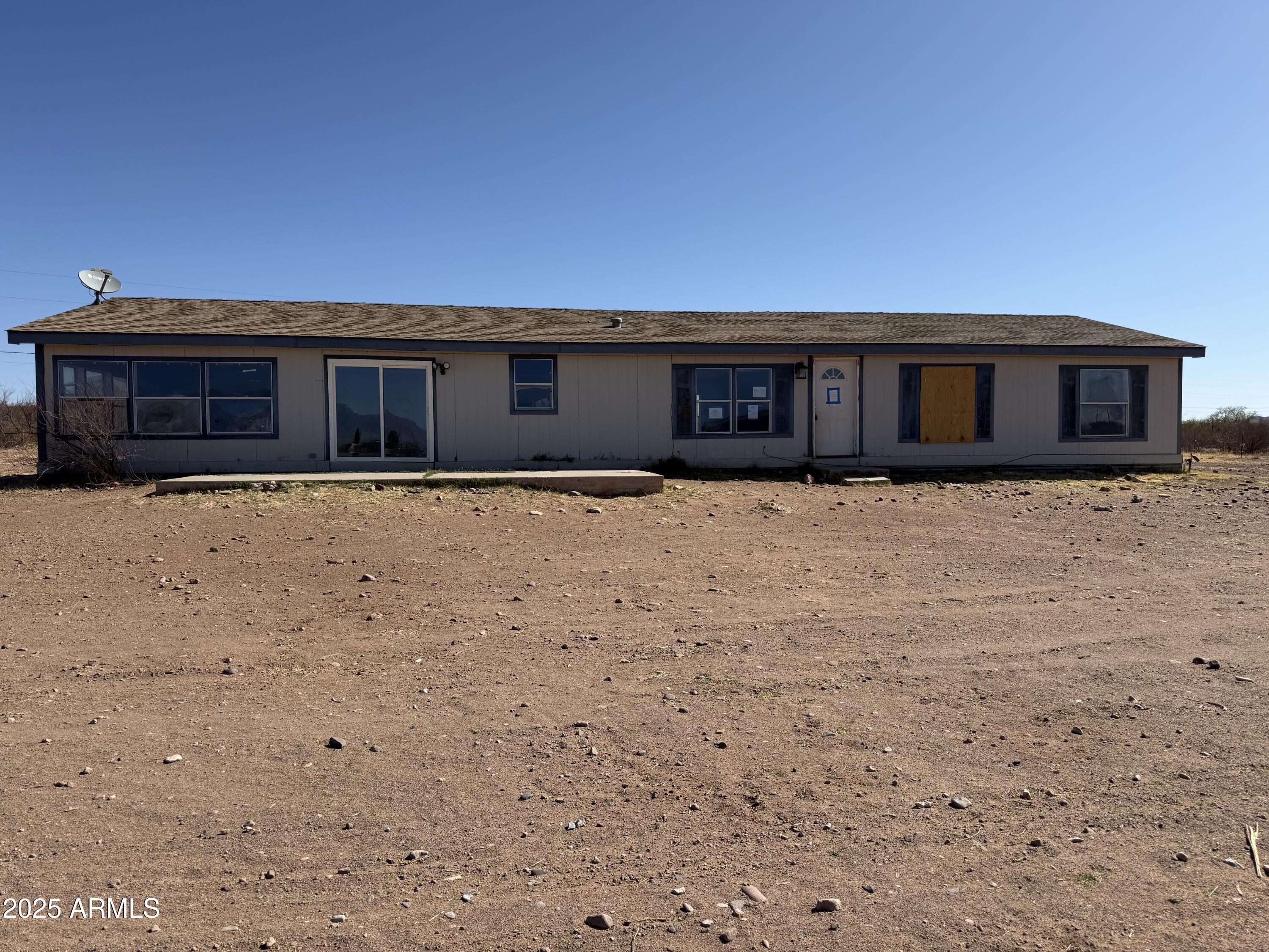 Are you looking for a very reasonable property with a mountain view? Take a look here. This home site on 4.5 acres and it is fenced and has 2 outbuildings. There is a well share and a septic system. The home does have a good floor plan and 4 bedrooms. There is central a/c as well.