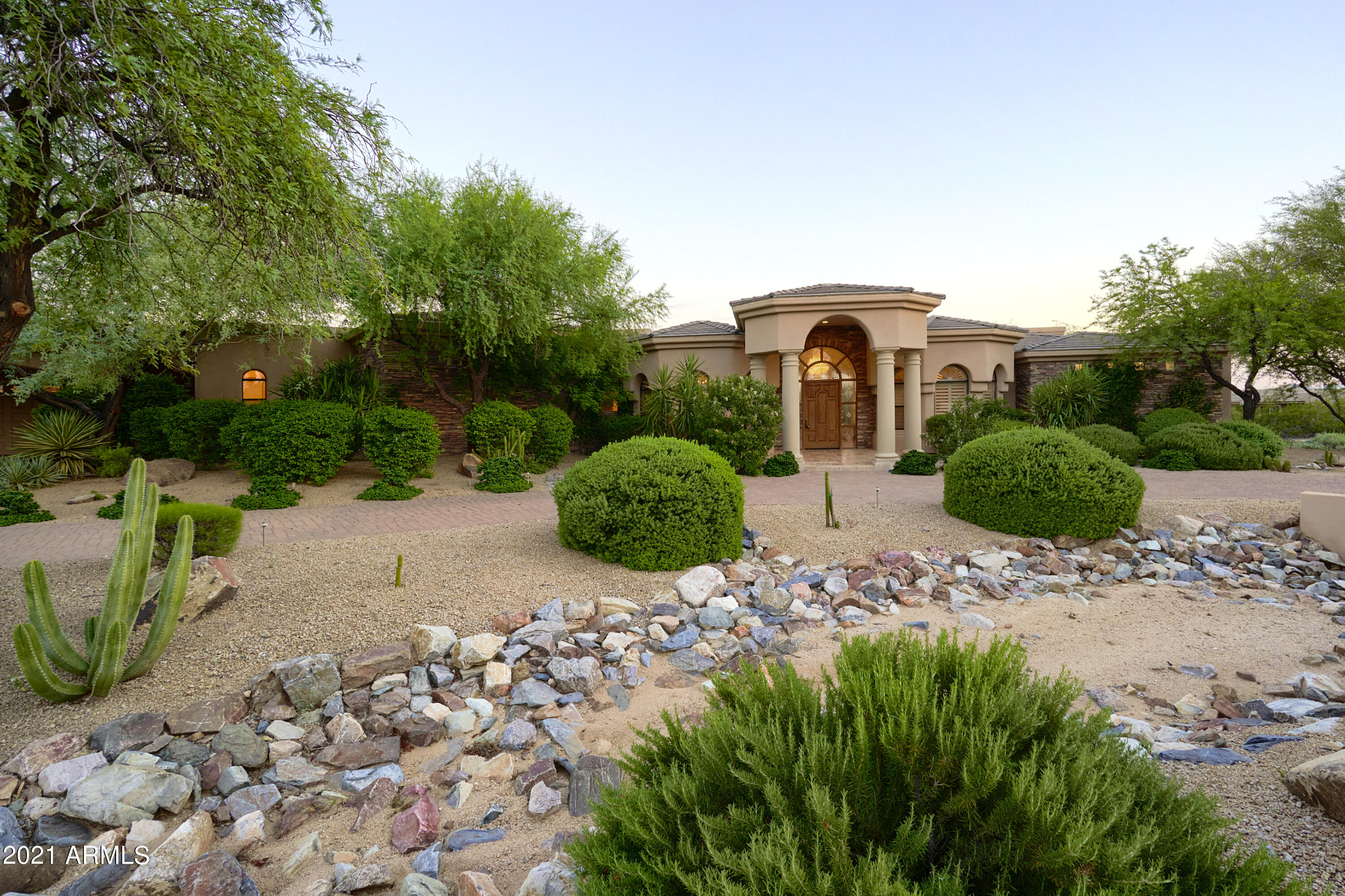 This gorgeous custom home features a split floorpan w/5 bedrooms plus den & home theater, 4.5 baths, formal living & dining rooms, and a 4 car garage that can be expanded to 6 cars! Seller has updated the majority of the home w/all new kitchen featuring new cabinets, quartz counters, custom tile backsplash, & Wolf/Subzero SS appliances which overlooks the large family room w/huge wet bar & fireplace. Master is next to office away from other bedrooms and features large soaking tub w/massive walking shower, newer porcelain floors that look like marble, chrome fixtures, and plus carpet. The home theater room is decked out w/the latest AV equipment and full theater seating.  Don't forget the back yard w/p-tec pool, spa, gazebo w/b-in bbq, & are grassy play area.  All on 1.5 acres w/south back