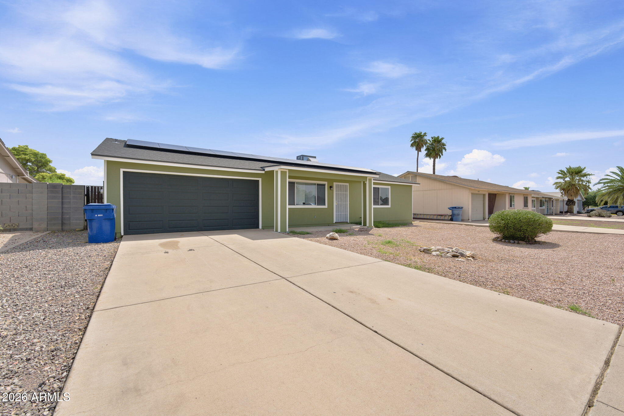 Welcome to this charming 2-bed, 1-bath home in Tempe's desirable Wood Park Village! Step inside to a bright, open layout with tile flooring, solar-screened windows, and a spacious eat-in kitchen. Enjoy year-round comfort with leased solar panels and a Tesla charging station, perfect for sustainable living. The large backyard with a covered patio is ideal for relaxing or entertaining. A two-car garage plus extra parking offers plenty of space for vehicles and storage. Located in a friendly neighborhood close to parks, top schools, shopping, dining, and major commuter routes--this move-in-ready home blends comfort, convenience, and eco-friendly features in a fantastic Tempe location!