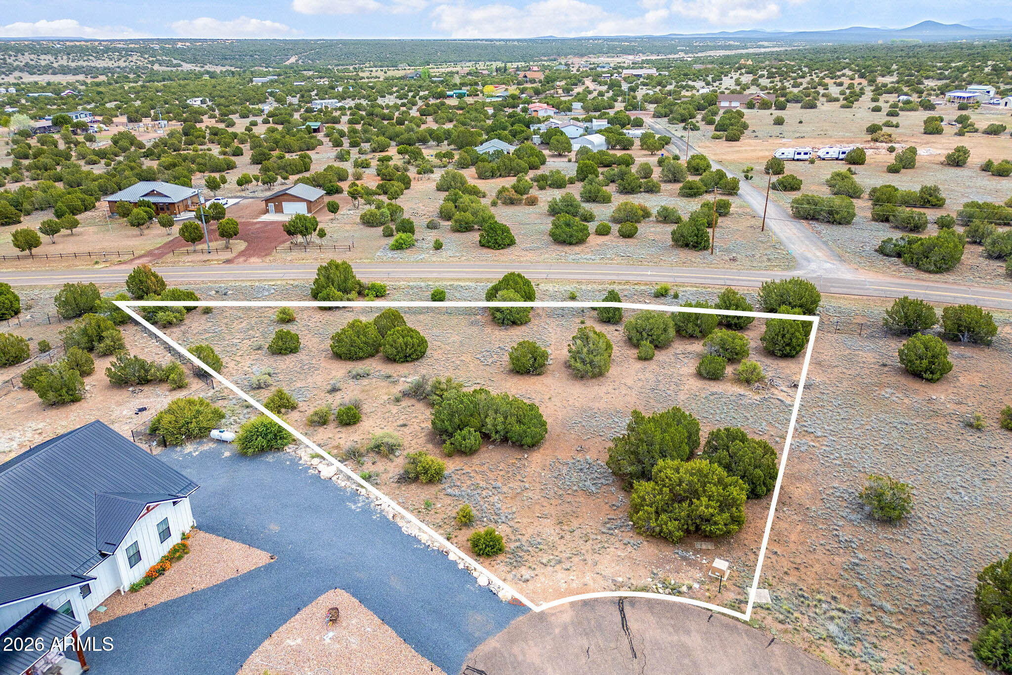 Discover the perfect canvas for your dream home in scenic Eagle Crest! This beautiful lot offers a prime location, ideal for a weekend retreat or year-round residence. The HOA includes full lake privileges and is just a short walk from Silver Creek Golf Course. Located only 15 minutes from downtown Show Low, you can enjoy tranquil mountain living while remaining close to local amenities. Don't miss this rare opportunity to build your perfect dream home in one of Arizona's most desirable communities.