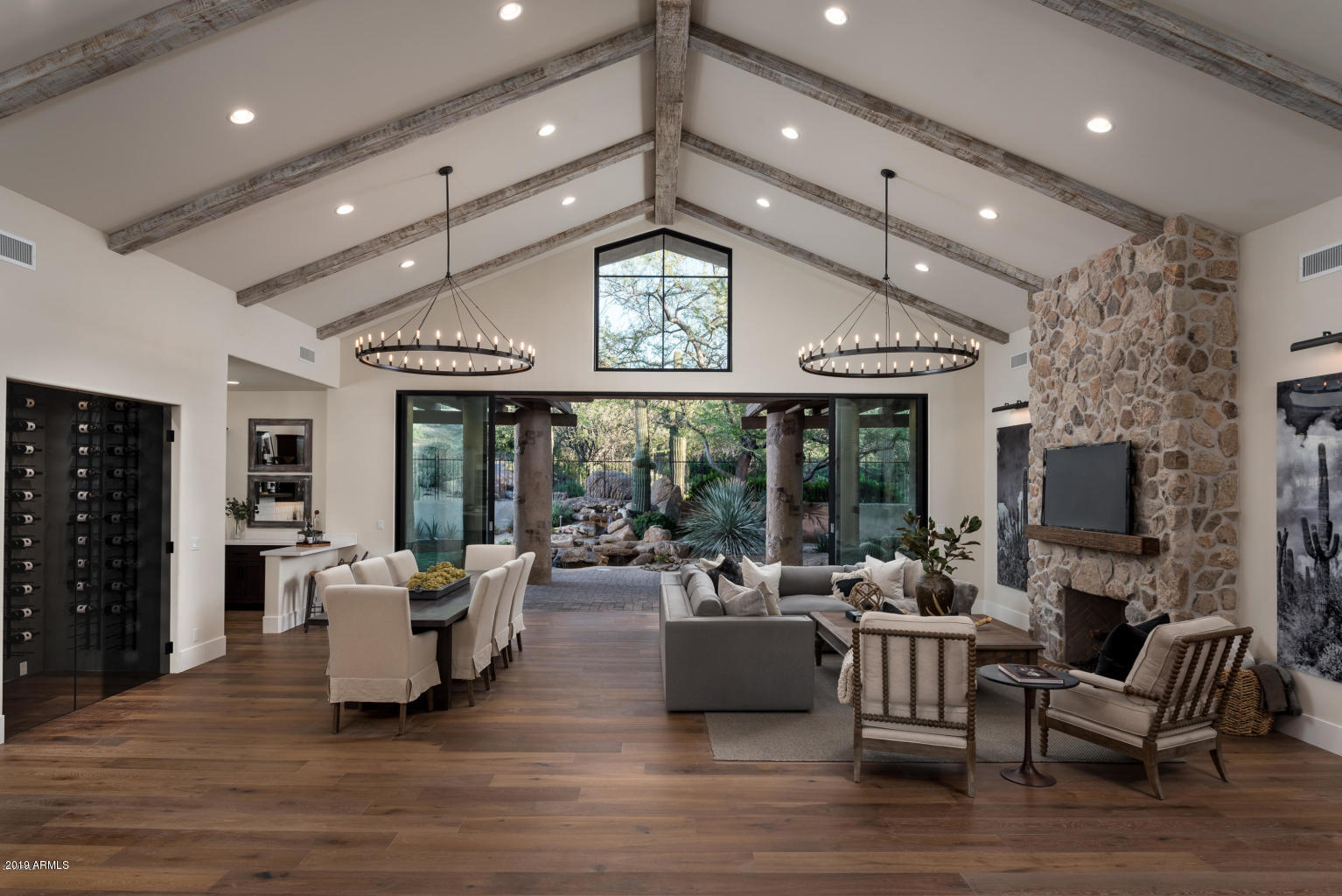 New 2018 - 5500sf - single level lock & leave in Scottsdale's most prestigious guard gated community! The absolutely BEST gated home under $3 million in the entire valley. Remodel done by Arizona's premier design/build/remodel firm. Private guest house with 2 bedrooms/2 baths & kitchen with Sub-Zero refrigerator. 2 luxurious master suites with white Italian marble, walk-in closets, sitting vanities, and separate freestanding tubs. Amazing open floor plan with zero steps. Huge kitchen with all new custom inset cabinetry, quartz countertops, Sub-Zero/Wolf appliances, Fleetwood sliding door, new plumbing, electrical, drywall, interior doors, etc-lives like a brand new home. Smart home with separate climate controlled wine room, gas fireplaces, European oak hardwood flooring. A must see