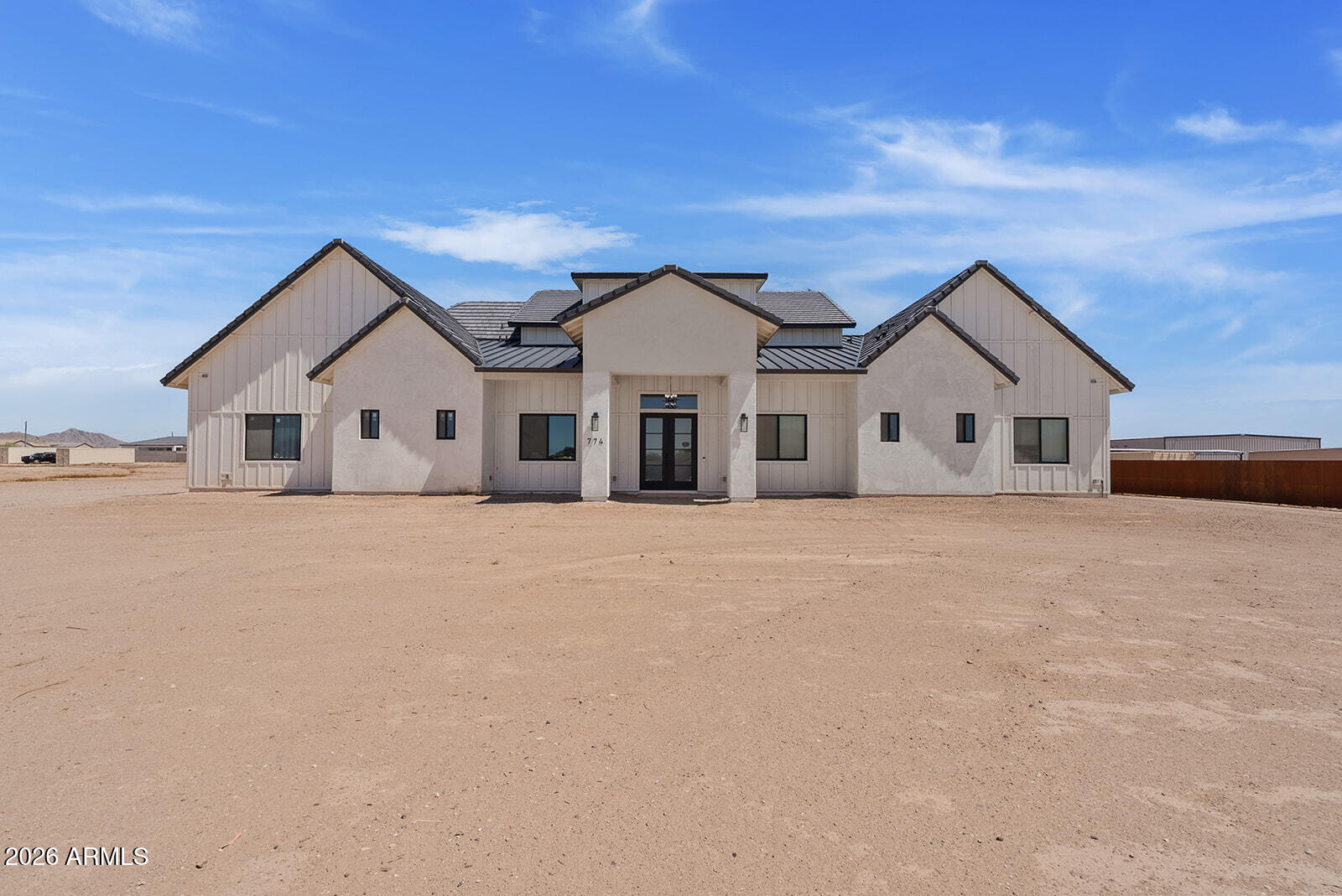 Experience luxury, space, and endless possibilities in this exceptional new construction home, completed in 2025. Situated on nearly 2 untouched acres, this 5,115-square-foot estate offers the perfect blend of modern design, functionality, and the opportunity to create the outdoor retreat you've always envisioned.

Inside, you'll find an expansive open-concept floor plan filled with natural light, soaring ceilings, and thoughtfully designed living spaces that are ideal for both everyday living and entertaining. With 4 spacious bedrooms, 5.5 bathrooms, a dedicated office, game room, and private home gym, every detail has been designed to accommodate today's lifestyle. The oversized 3-car garage provides ample space for vehicles, storage, or hobbies.

One of this home's greatest features the ability to add your own personal touch. The generous homesite offers a blank canvas to design the backyard of your dreams--whether that's a resort-style pool, outdoor kitchen, guest casita, RV garage, sports court, or lush landscaping. The possibilities are truly endless.

Located in the growing San Tan Valley area, this home offers the best of Arizona living with breathtaking mountain views, nearby hiking and outdoor recreation, golf courses, shopping, dining, and convenient access to Queen Creek amenities. Enjoy the peace and privacy of estate-style living while remaining close to top-rated schools, everyday conveniences, and major commuter routes.

This is more than a home--it's an opportunity to create a lifestyle tailored entirely to you.