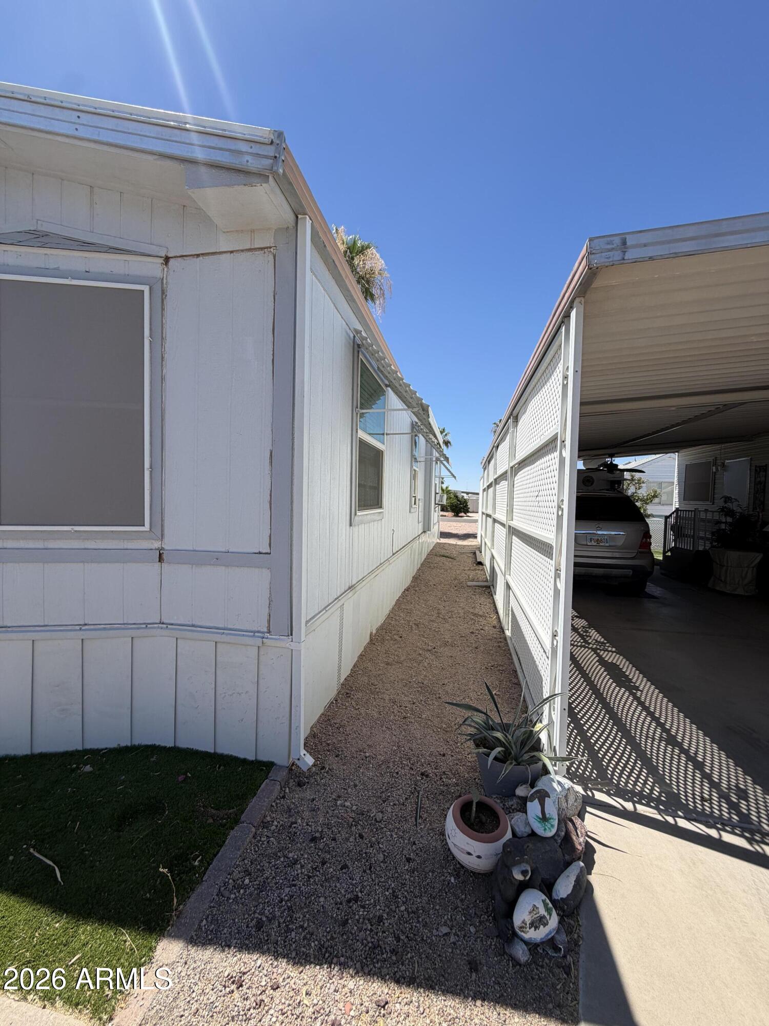 Well maintained Home in a 55+ park, fully furnished with custom updates through out, new awning over the covered carport, with a shed and wheelchair lift. The home is being sold as is In the quiet Mosaic Sun Mobile Home Park.