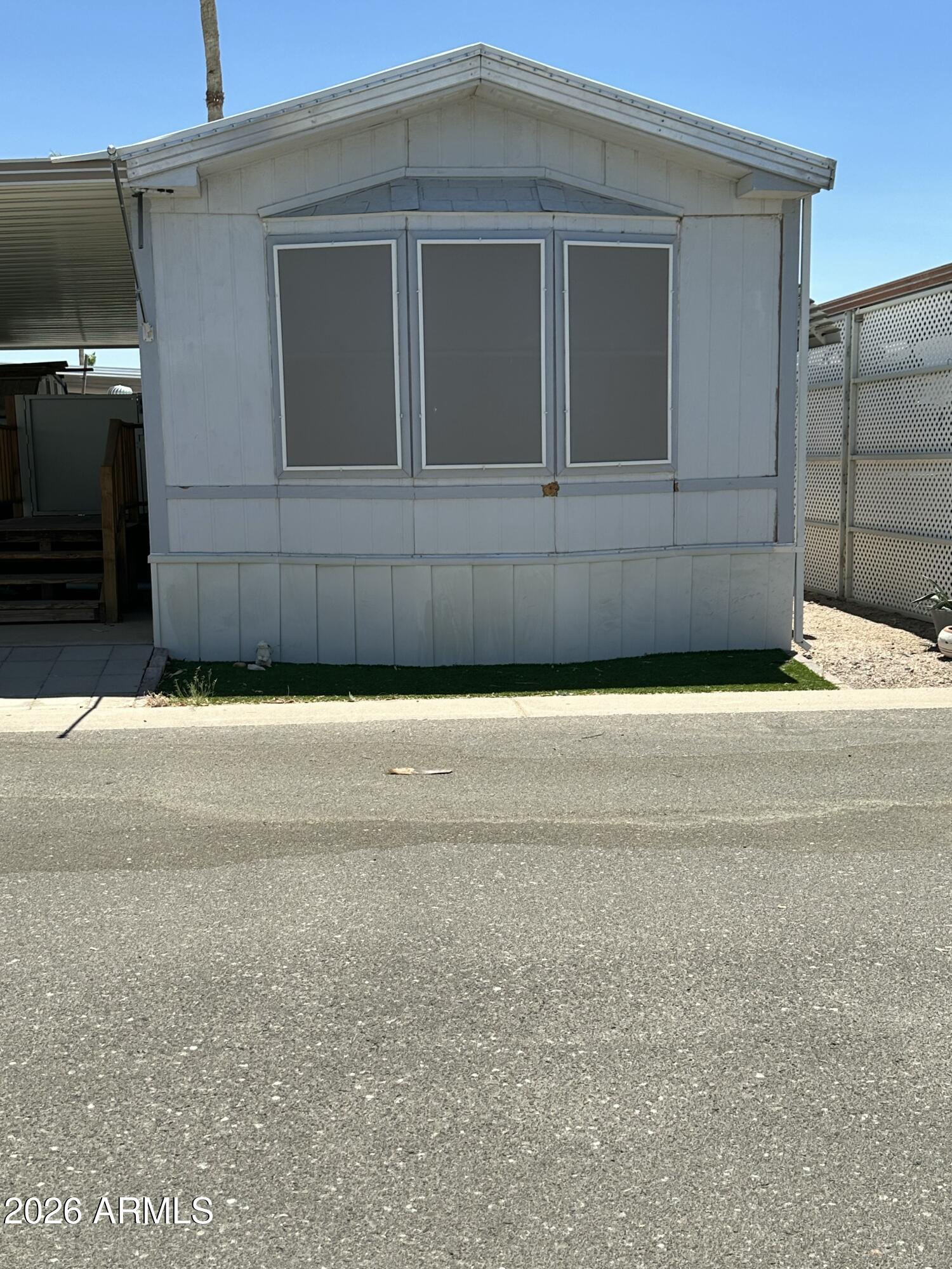 Well maintained Home in a 55+ park, fully furnished home with custom updates through out, new awning over the covered carport, with a shed and wheelchair lift. The home is being sold as is In the quiet Mosaic Sun Mobile Home Park.