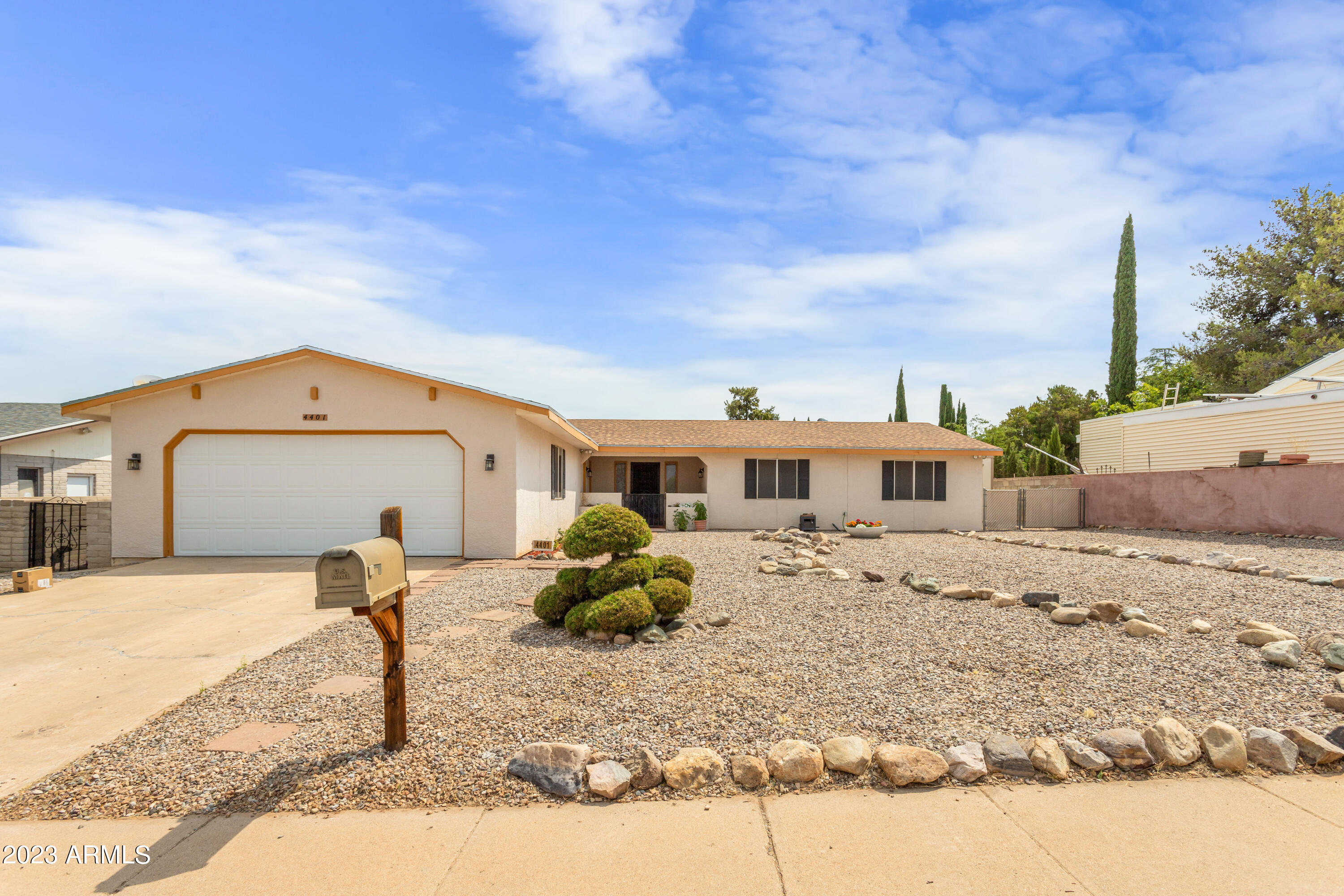 Step in to the courtyard and start planning the perfect retreat! Fantastic north south exposure give this home ideal areas to enjoy the outdoors throughout the day. Be welcomed through the front door by a beautiful stone work fireplace in the Living room off to the left you will find a large den and eat in kitchen ready to whip up new memories in. To the right are wonderfully sized bedrooms perfect for any space you need! Out back you will find a raised deck and freshly installed sod, complete with separate dog run! Even more!  There is a shed to store whatever you might need PLUS an RV gate! Don't miss this centrally located gem!