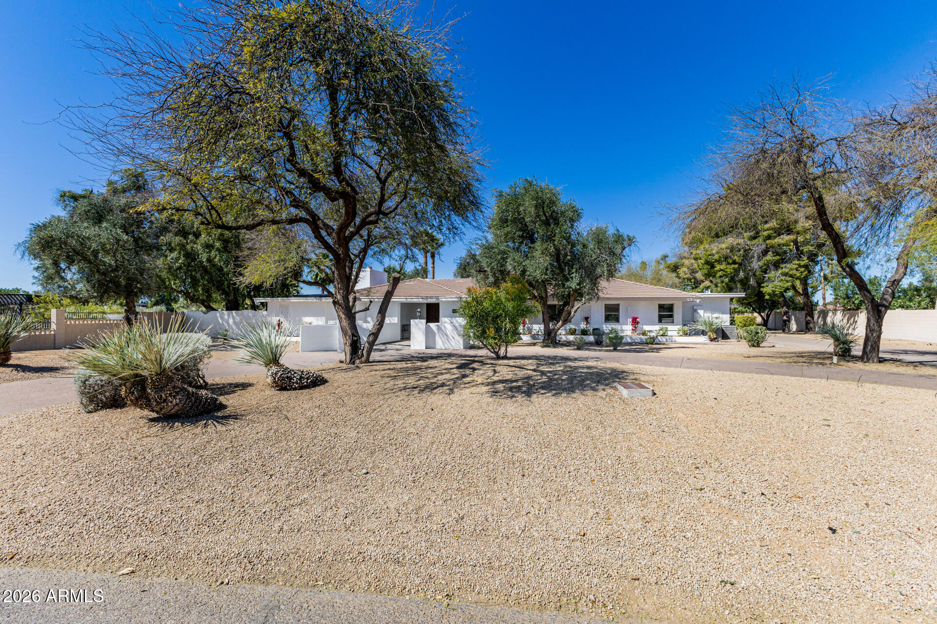 Rare opportunity in one of Scottsdale's most desirable and sought-after communities, Orange Tree Golf Course. Situated on over an acre, this property is one of the largest lots in the neighborhood and offers exceptional privacy with golf course views at the 17th tee box. No HOA . The unique shape of the lot creates an incredibly large backyard, providing a rare park-like setting with mature trees, a sparkling pool, and expansive lawn areas. This remarkable outdoor space is perfect for weddings, private events, large family gatherings, and unforgettable entertaining under the Arizona sky. A truly special property offering space, privacy, and a prime Scottsdale location close to golf, dining, shopping, and entertainment