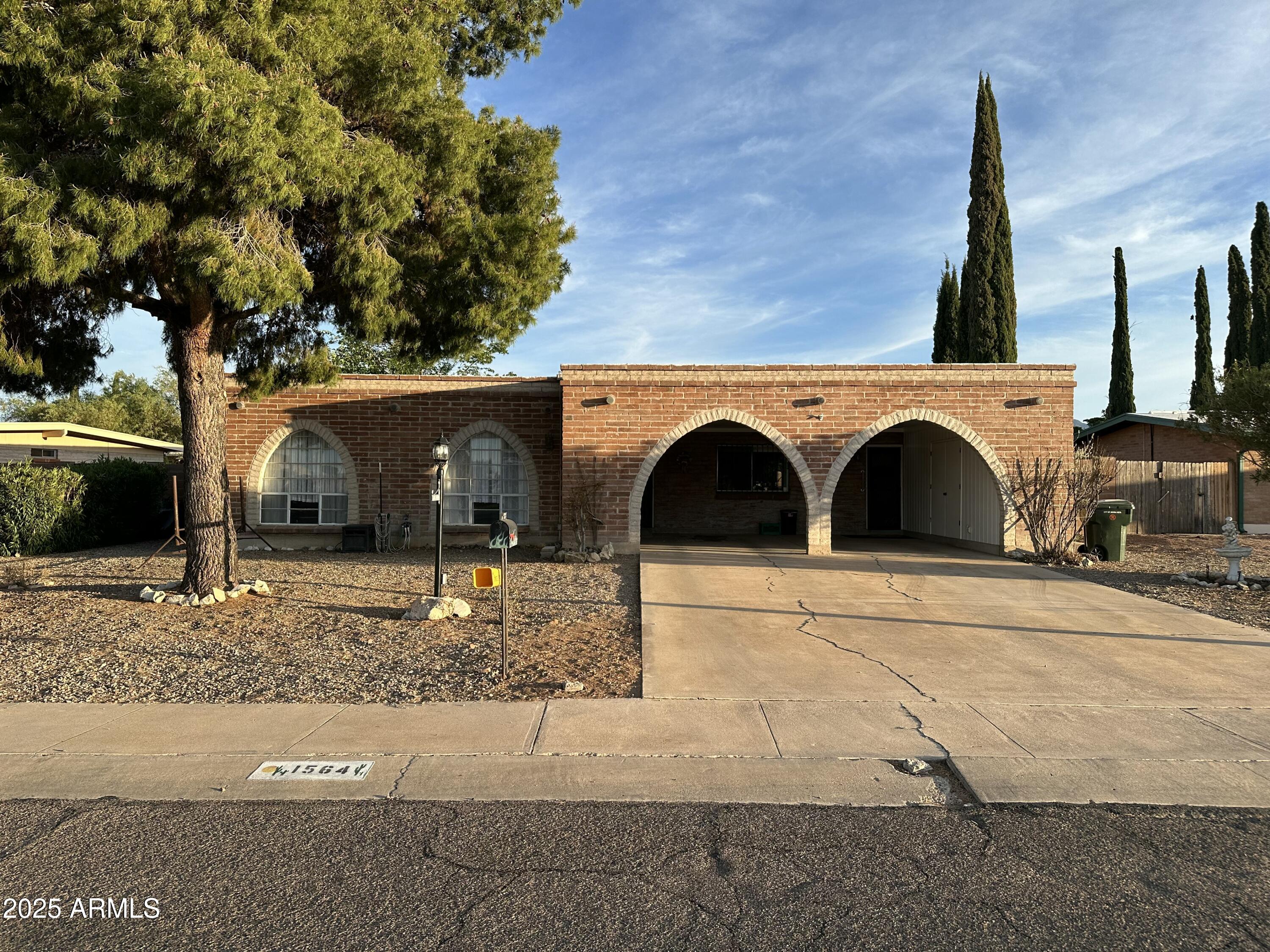 Discover this charming home that is nestled in the heart of Sierra Vista, making it close to Fort Huachuca, shopping, and schools. Built in 1968, this residence offers a generous 2,022 sq ft of living space. Most of the floors have been updated in 2025 and new paint has been added. It comes with multiple living areas, eat-in kitchen, dining room, three storage sheds and more. With it's 4 bedrooms and 2 bathrooms, it offers plenty of living spaces to get creative and provides the opportunity for comfort and convenience.