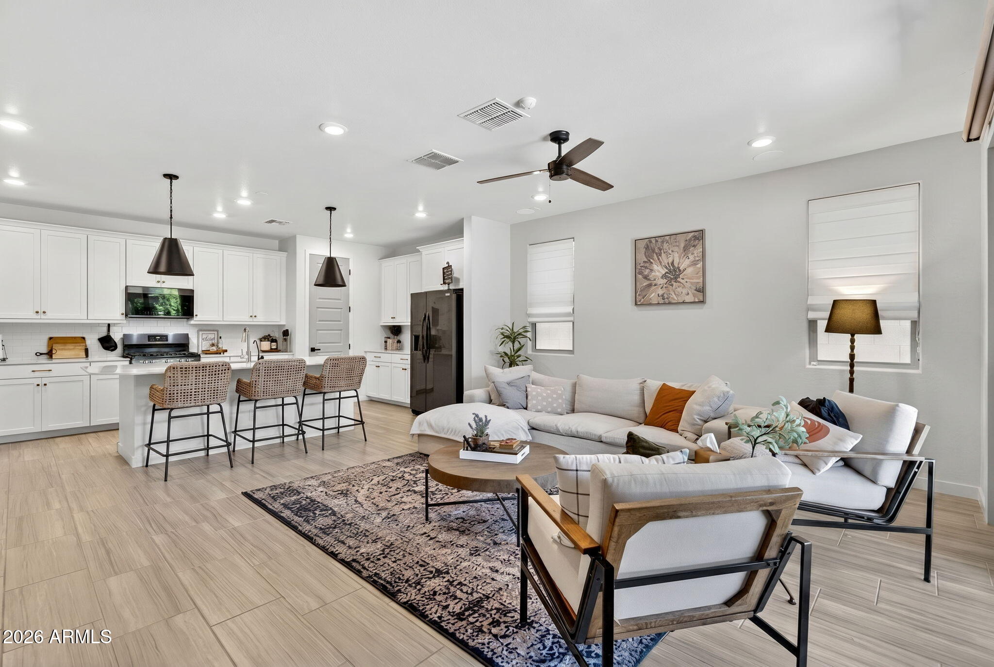 Modern upgrades and functional living in the highly desirable community of Cadence, featuring resort-style amenities including; pools, workout facility, sports courts & more! This 4 bed, 3 bath home features an open-concept, designed for everyday living & entertaining. The kitchen has white shaker cabinets, quartz countertops, reverse osmosis system + an oversized island. Overlooking the living room you'll find motorized blinds for added convenience. 
The split floorplan offers added privacy! The fully remodeled primary bathroom features beautiful oak cabinetry, sconce lighting & a soaking tub.Enjoy a low maintenance backyard with artificial turf and a covered pergola! 1% Flex Credit to be applied towards closing costs or rate buydown offered by preferred lender for qualified buyers