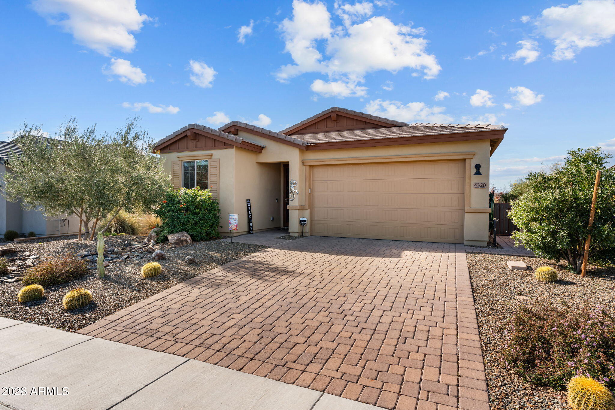 Located in the highly sought-after Lonestar community of Wickenburg Ranch, this beautifully upgraded 1580 sq ft home sits on a fully fenced, spacious 7,553 sq. ft. lot, offering ample room to add a pool and outdoor entertaining. Residents enjoy easy access to Lake Park, perfect for catch-and-release fishing or peaceful walks with pets, as well as the nearby dog park. Convenience is unmatched with a short stroll to the mailbox, the Lil Wick 9-hole golf course, and the popular Watering Hole. Inside, the home showcases an impressive array of upgrades and thoughtful design features. Highlights include a 3-car tandem garage, upgraded appliances, sleek cabinetry with under-cabinet lighting, crown molding, decorative cornice box window coverings, shutters, and two electric sun shades. The well-appointed kitchen offers a walk-in pantry for abundant storage, while a built-in BBQ enhances outdoor living and entertaining. Additional features include a water filtration and softener system, a utility sink in the laundry room, and French doors leading to a cozy den or flex space. Luxurious finishes continue throughout the home, creating a refined yet comfortable living environment. This exceptional property offers the perfect blend of style, functionality, and the sought-after Wickenburg Ranch lifestyle.