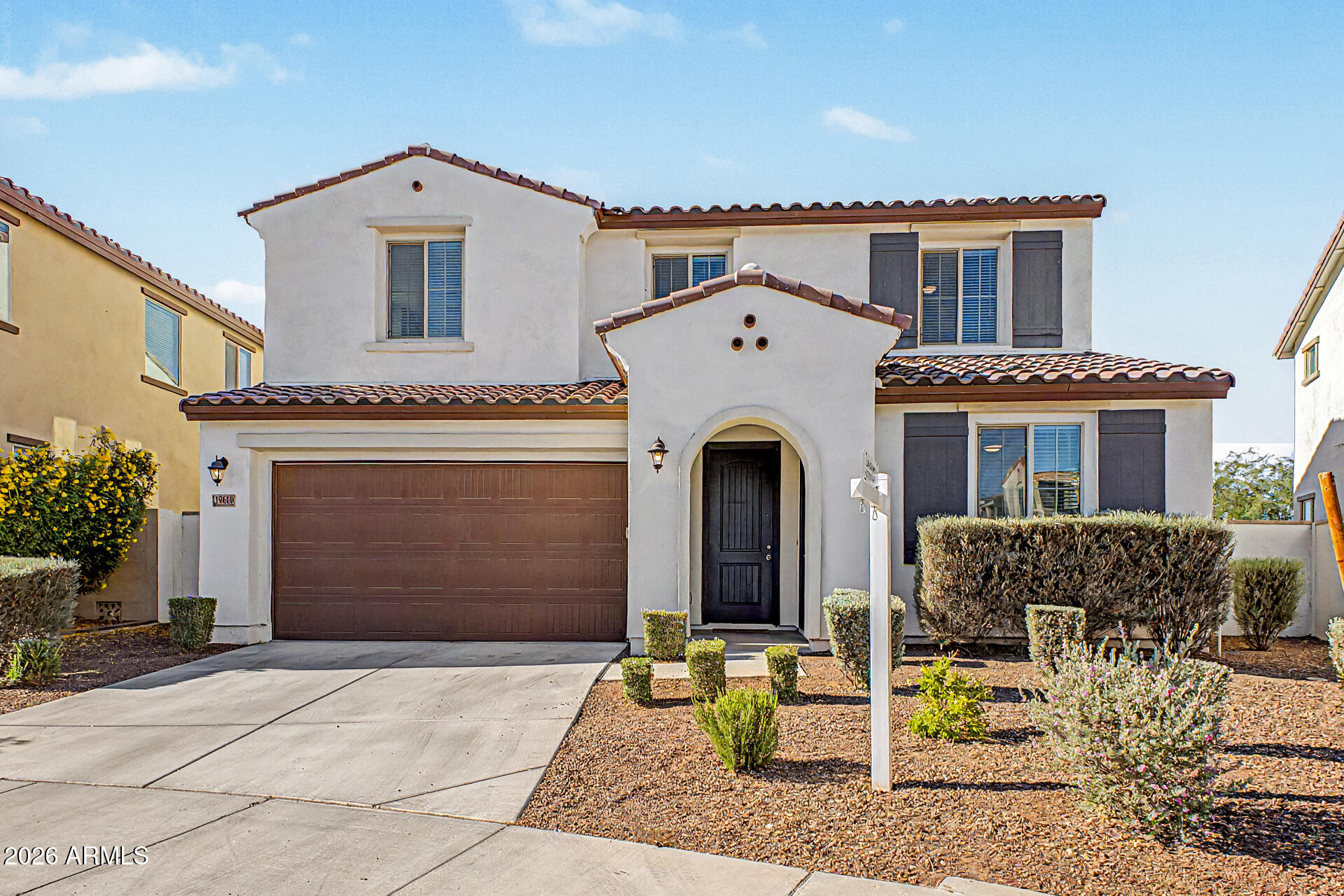 Amazing opportunity to purchase almost 3000SF multigen house in Verrado for only $550K! 5-bedroom, 3.5 bath plus loft and new interior paint throughout. Open floor plan with wood tile flooring and upgraded kitchen has built-in appliances, quartz counters, tiled backsplash and a center island that adds to the counter space. Primary bedroom features a walk-in closet and private bathroom with dual sinks. Separate guest's quarter complete with its own entry, kitchenette, family room, separate bedroom/bath and laundry. This private space is perfect for visitors or multi-generational living. Don't miss the backyard with no neighbors directly behind, covered patio and low maintenance landscaping with artificial turf. Also includes all the amenities that master planned Verrado has to offer