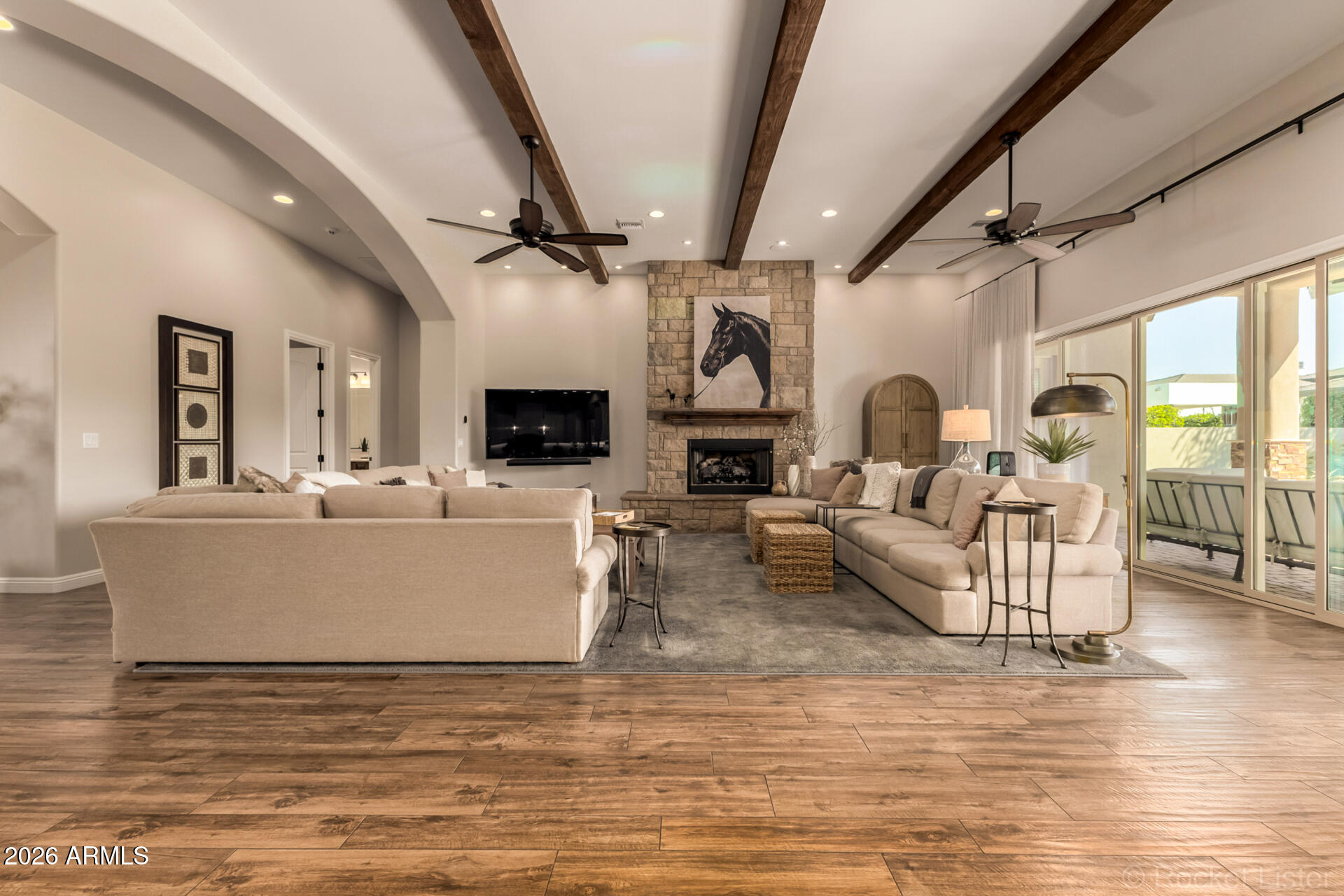 Welcome to this stunning custom home nestled in one of Chandler's most prestigious communities -- Whitewing at Krueger --  perfectly positioned on a serene greenbelt interior lot with coveted southern exposure. With over 4,000 sq ft of thoughtfully designed living space, this meticulously maintained and updated home offers the ultimate Arizona lifestyle. The open floor plan centers around a dramatic great room featuring wood beam ceilings and a striking stone fireplace, flowing seamlessly into a gourmet kitchen with granite countertops, stainless steel appliances, an oversized island, walk-in pantry, and wine room.The split floor plan provides privacy for all, with generously sized bedrooms boasting walk-in closets, en-suite bathrooms, and abundant space to suit any lifestyle. Step outside through 20-ft glass sliding doors to your private resort -- a sparkling pool and spa with gas fire features, a tongue-and-groove covered patio with built-in misters, a sport court, and a park-like yard designed to embrace Arizona's beautiful winter sun while staying cool all summer.

Location couldn't be better -- just 2 miles from the SanTan Freeway and under a mile to grocery stores, gyms, and everyday amenities, putting everything Chandler has to offer right at your doorstep.

This home truly has it all: luxury, space, function, and an unbeatable location.