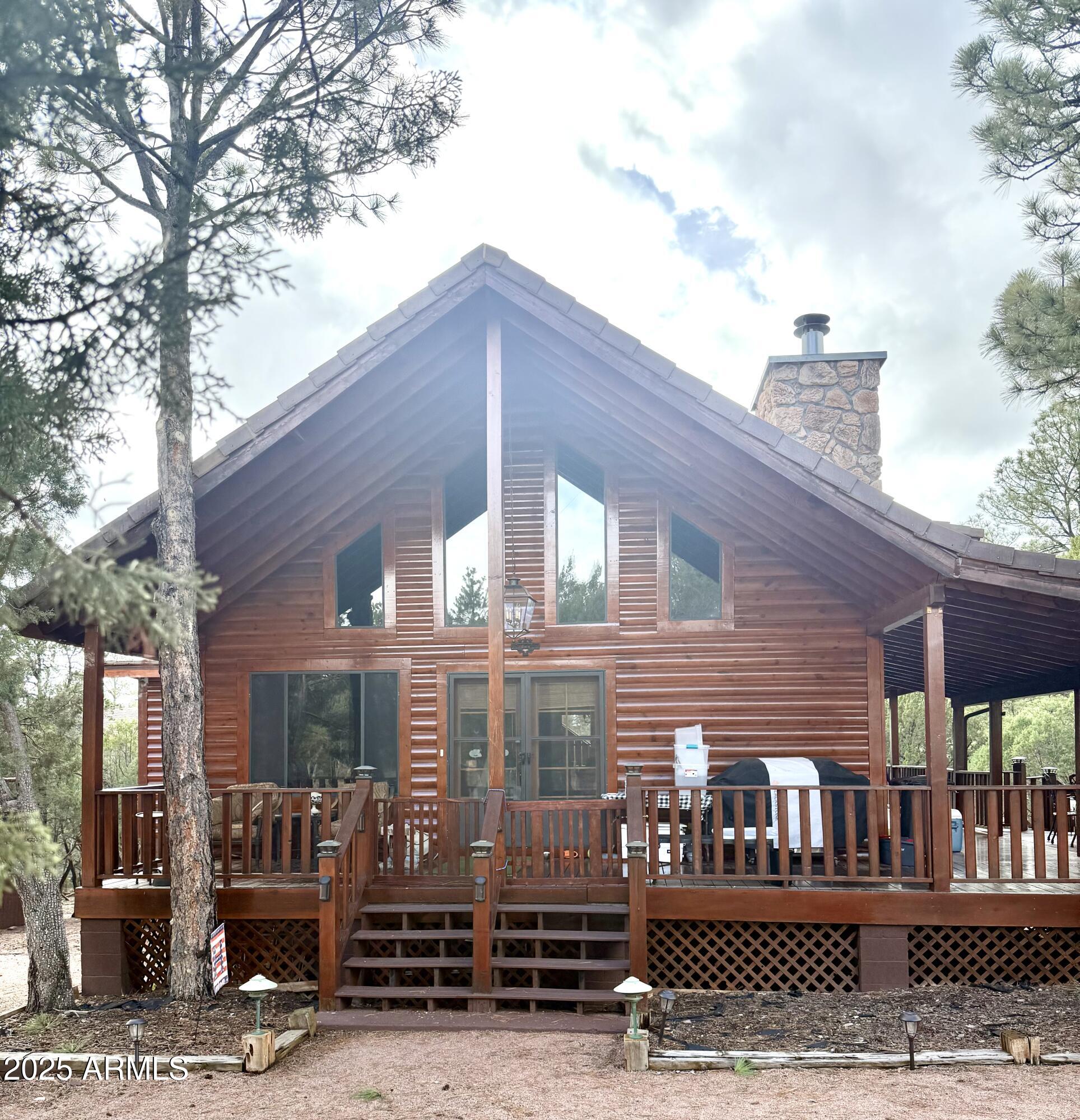 Beautiful Well-Maintained Cabin Surrounded by Wildlife in the Cool Pines of Overgaard in Mogollon Airpark. FLY INTO Your Almost One-Acre Cabin on a Cul-De-Sac Which Features Beautiful Wrap-Around Balconies on 2-Levels with Views of Beautiful Pines, an Inviting Hand-Built Stone Fireplace in the Great Room, an en Suite Master Bedroom with Master Sitting Room, Second Bedroom on the Entry Level, Full Guest Entry Level Bathroom, a Large Open Loft with Full Bathroom and Bar, and Abundant Wildlife.  Nothing To D But Bring Your Outdoor Equipment! New Central AC in 2024, New Hot H2O Heater 2025, Fresh Exterior Staining in 2024, Fresh Interior Paint 2024, New Kitchen Appliances in 2025, and New Roof Liner (Under Concrete Tile Shingles) in 2024. "Mogollon Airpark (AZ82) Overgaard, AZ. Many of us have traded the heat of the summer for those cool breezes whispering through the tops of the pines on the Mogollon Rim. At 6,658', 50 miles east of Payson, 35 miles west of Show Low, surrounded by the Apache-Sitgreaves National Forest and nestled in the world's largest stand of those Ponderosa pines, lies the magnificent Mogollon Airpark.

Officially in the town of Overgaard and next to its neighbor, Heber. Like most airparks Mogollon is private and is not open to the public for general operations. However, it's open to guests of airpark residents. The only requirement is that the guest pilot execute a hold-harmless agreement (available via the website) and submit it in advance of their arrival. This is mentioned on the airpark's homepage at (removed).

It's not just a beautiful location. A 30 minute drive from the airpark, in its mid-80s summers, gives you access to 5 Alpine lakes with all the fishing, kayaking, hiking, golfing, horse and ATV trails.... you could ever dream of. Let's not forget to mention that an hour-and-a-half will get you to Sunrise Park, Arizona's largest ski resort. To paraphrase John Geddes, "...freshly cut trees smelling of stars and snow and pine resin - inhale deeply and fill your soul with wintry night..." Wow! A place with a little bit of every season to enjoy.

All the cedar-sided homes within the park have similar architecture to maintain a harmony with nature. The 56 aircraft on the field are housed in the hangars of like construction that also seem to slip quietly into the woodsy background. The Homeowners Association proudly hosts an annual summer fly-in with exhibitions, serving breakfast and lunch. Even with the higher density altitude, the 3420'x50' asphalt runway can accommodate most aircraft, but be ready to stay the night or take-off before sunset as the runway is for day use only. Good thing... wildlife on the runway is a distinct possibility.

The residents boast Mogollon to be the friendliest airpark in Arizona. With community center facilities for the pot luck dinners, movie nights, raffles... they definitely know how to have a great time!"