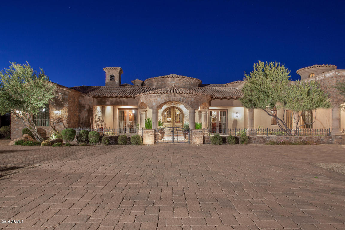 The time is Now! Let's make a Deal! Incredible sprawling estate situated on 8.75 acres of beautiful Sonoran Desert.  The main home features 7,646 SF with another 1,746SF in 2 separate detached guest homes.  Unrivaled details and quality craftsmanship throughout including Venetian Plaster walls, hand carved Cantera stone fireplaces, custom cabinetry, 24'' Cantera tile floors, Chef's kitchen with double Dacor ovens, copper sink, Alder cabinet doors, 600-700 bottle wine cellar, home theater, home office, and the list goes on!  Imagine entertaining guests on your spacious patio or in the resort like pool and spa, all while enjoying spectacular views of Black Mountain. Seller may carry short term with substantial down.