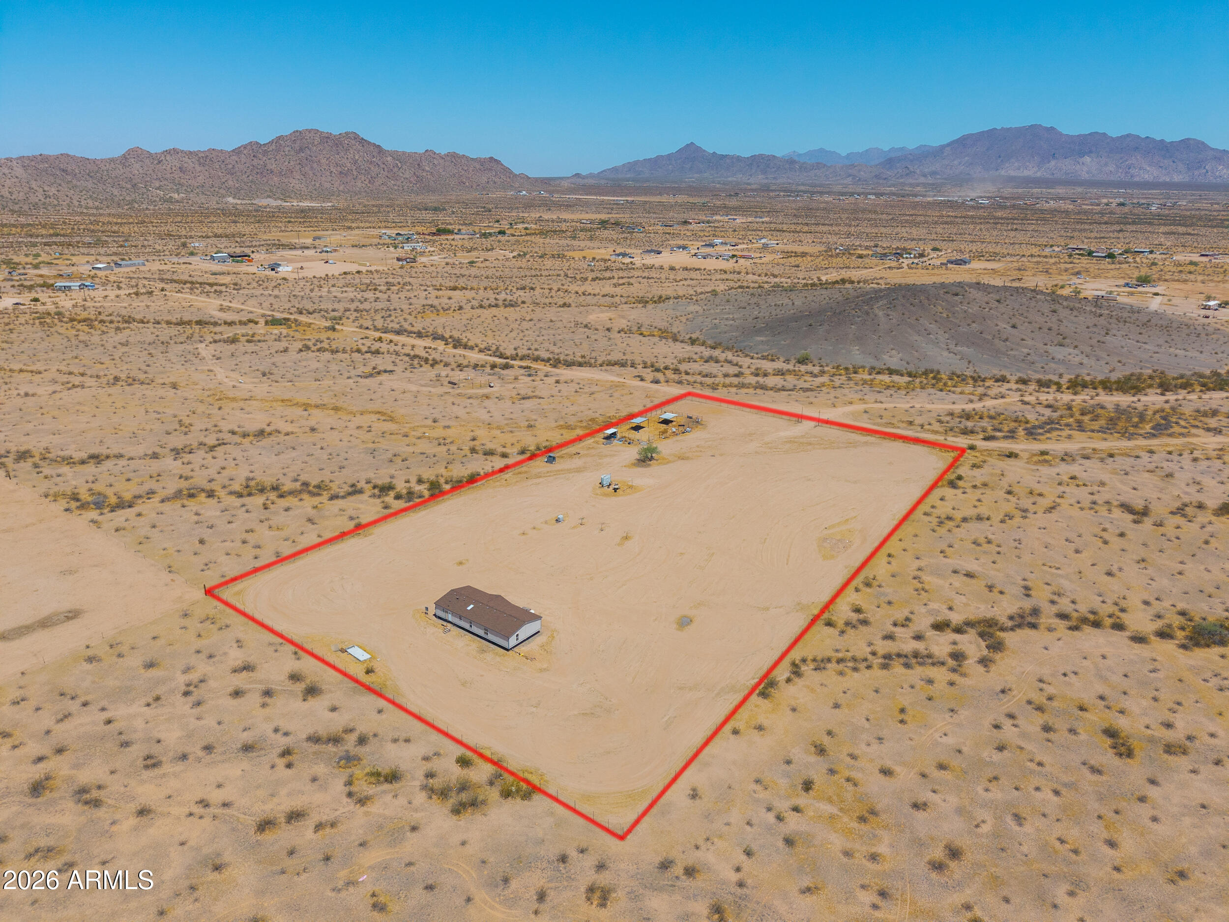 Experience the freedom of country living on nearly 5 fully fenced acres in the desirable Hidden Valley North area! Surrounded by breathtaking mountain views and wide-open desert landscapes, this property offers the perfect blend of privacy, space and opportunity with no HOA restrictions. Bring your horses, RVs, off-road toys, trailers and all your outdoor hobbies- there's room for it all. The nearly 1,700 sq ft manufactured home features 4 bedrooms and 2 bathrooms and has been recently remodeled, offering a great foundation to add your personal finishing touches and create the home you've always envisioned. Major upgrades include a BRAND NEW septic system and hauled water service. Enjoy spectacular Arizona sunsets, star-filled skies and endless possibilities on this prime acreage property!