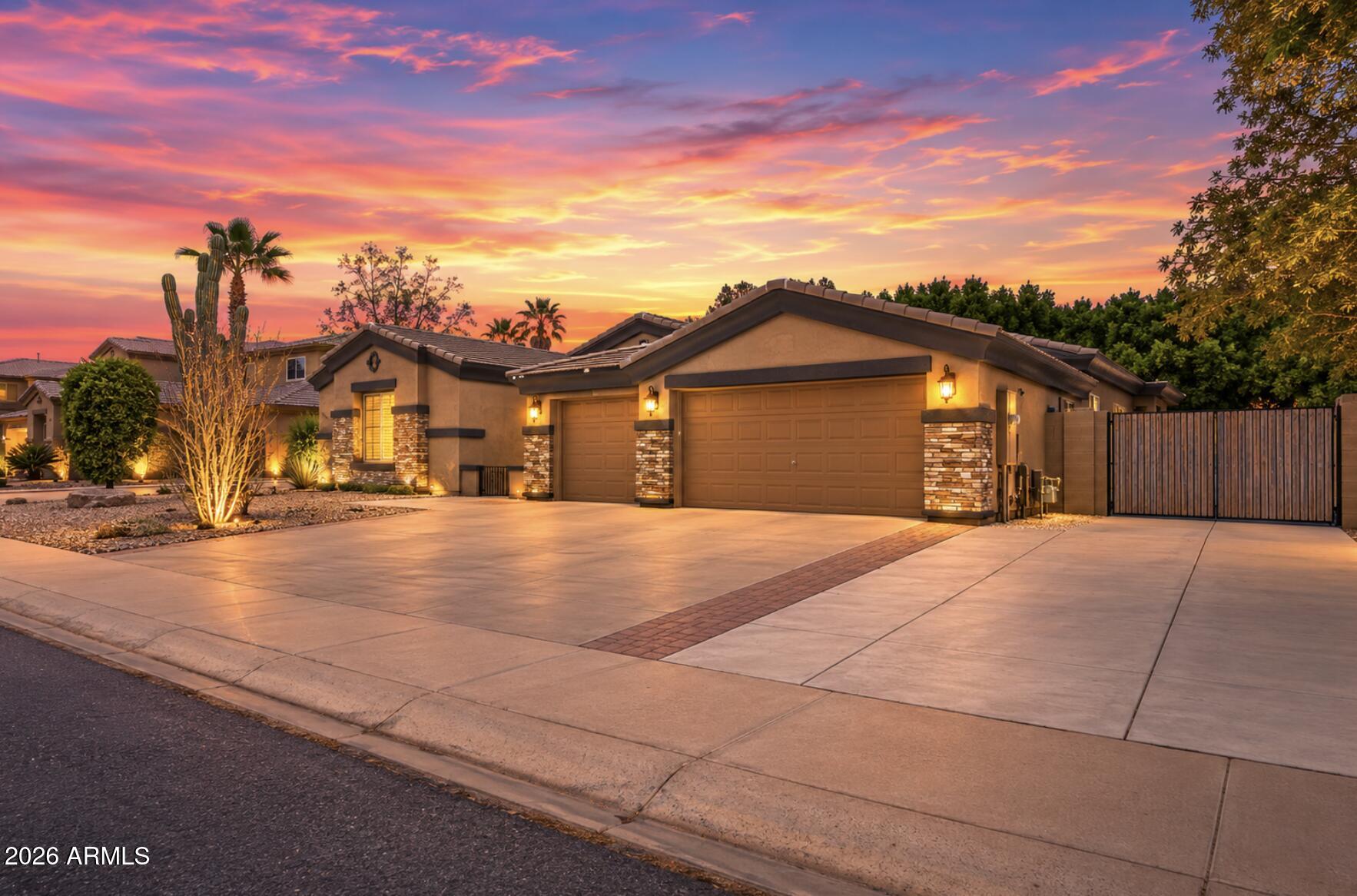 Fantastic opportunity to own this delightful 4-bedroom home in Dreaming Summit! You're welcomed w/ a 3-car garage, an RV gate, & tasteful stone accents. Fall in love w/ the inviting living room featuring high ceilings, a soothing palette, classic plantation shutters, & wood-look flooring. You'll also find a versatile den ideal for an office or study. Gather loved ones in the great room, complete w/ sliding door access to the backyard. The gourmet kitchen boasts granite counters, wood cabinetry w/ crown moulding, recessed lighting, sleek SS appliances, & a center island. The sizeable primary bedroom showcases a lavish ensuite w/ double vanities & a large walk-in closet. The enchanting backyard boasts a covered patio, pavers, an attached storage shed, & a sparkling pool. Make this gem yours!