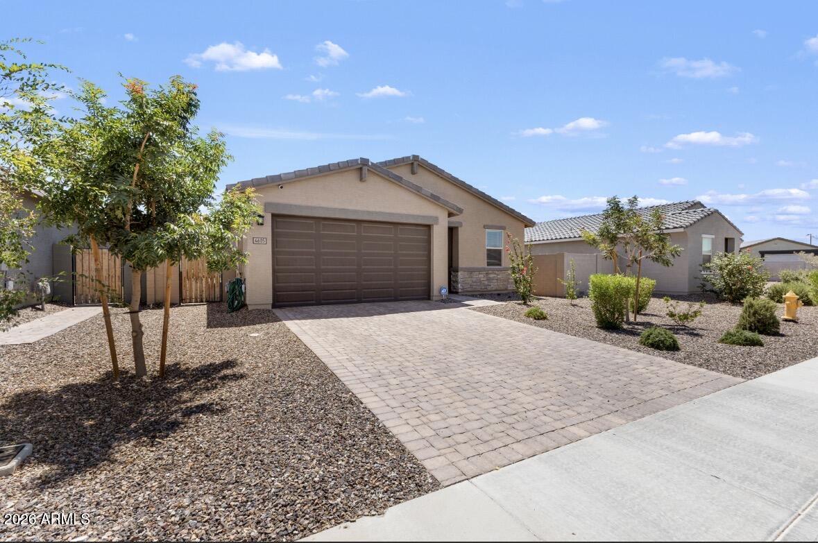 Welcome home to this stunning 2023-built Meritage home featuring 4 bedrooms, 2 bathrooms, and modern finishes throughout. Enjoy an open-concept floorplan with a spacious kitchen showcasing granite countertops, white cabinets, stainless appliances, and oversized island seating. The private primary retreat offers dual sinks, abundant storage, and a large walk-in closet. Outside, enjoy a covered patio, expansive grassy backyard, and low-maintenance landscaping. Modern construction, energy efficiency, and move-in ready convenience all in one package.