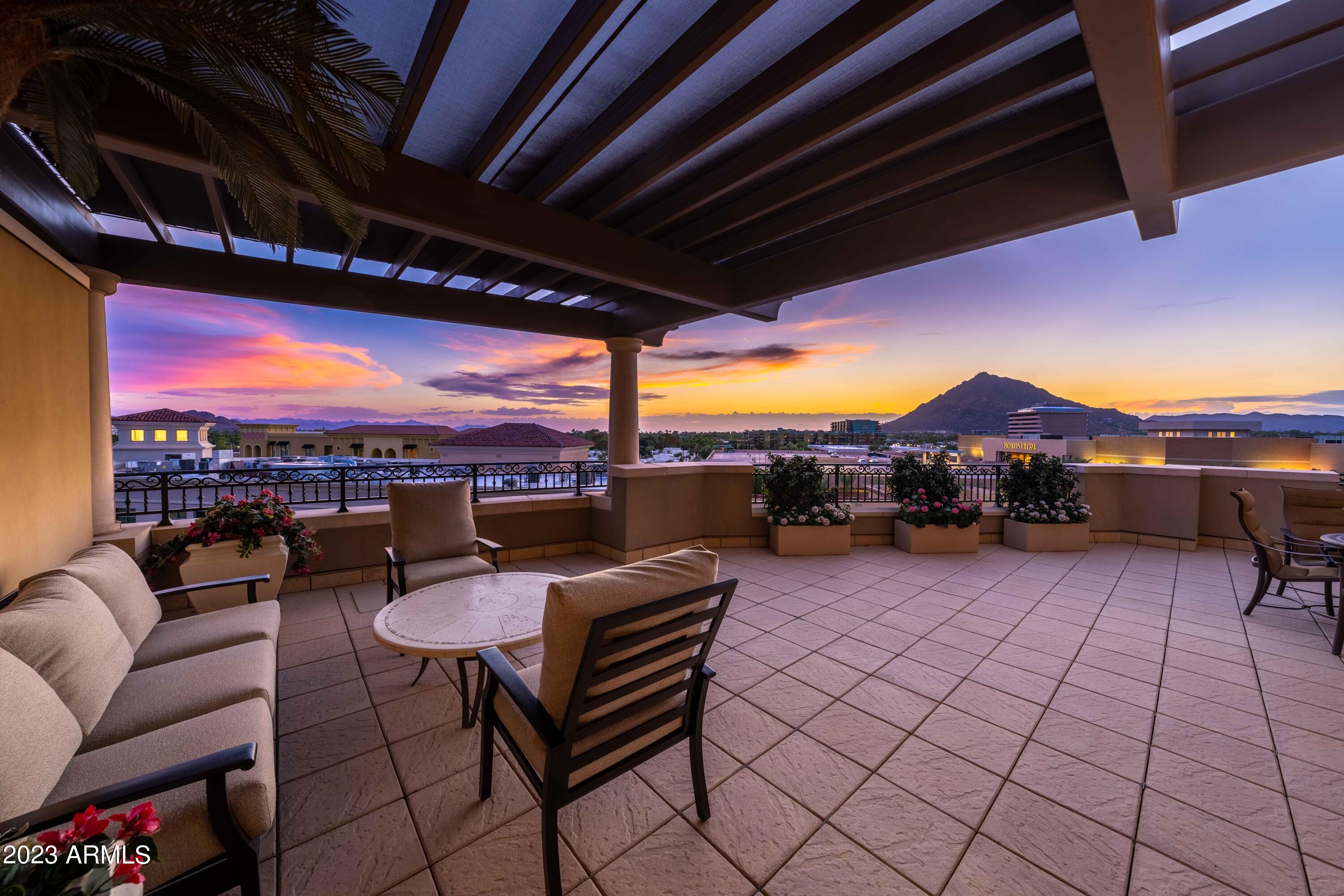 Spectacular, private unit featuring grand, open floor plan, expanding out to 900 sq ft terrace with stunning Mountain & City light views! Gorgeous newer electric window treatment throughout. New fireplace & beautiful cabinetry in great room and office with desks & file drawers. Den location allows for alternative use. Kitchen opens to expansive great room including large island with seating for six, extensive cabinetry, double ovens and ice maker conducive to creating bar at island! Elegant hallways with mirrored cabinetry leads to striking powder bath,  Private Master Bedroom with views of Camelback Mtn & large 2nd & 3rd en-suite bedrooms. Sliding doors in kitchen & 2nd bedroom leads to 2nd balcony with views! Two parking spaces on G1 with EV outlet that conveys with unit. Just Exquisite Cabinets throughout unit and storage unit have amazing organizational set ups including classy closet and other systems.
Beautiful sound system throughout home.
Enjoy the luxurious lifestyle Scottsdale Waterfront Residences has to offer including 24/7 front desk service, private and gated underground parking and valet, fitness center and spa, elegant entertainment room with bar and private dining rooms, chef's kitchen for private parties, rooftop pool and spa with spectacular views, wine cellar with private storage unit, BBQ at pool and club room. Outstanding amenities!!