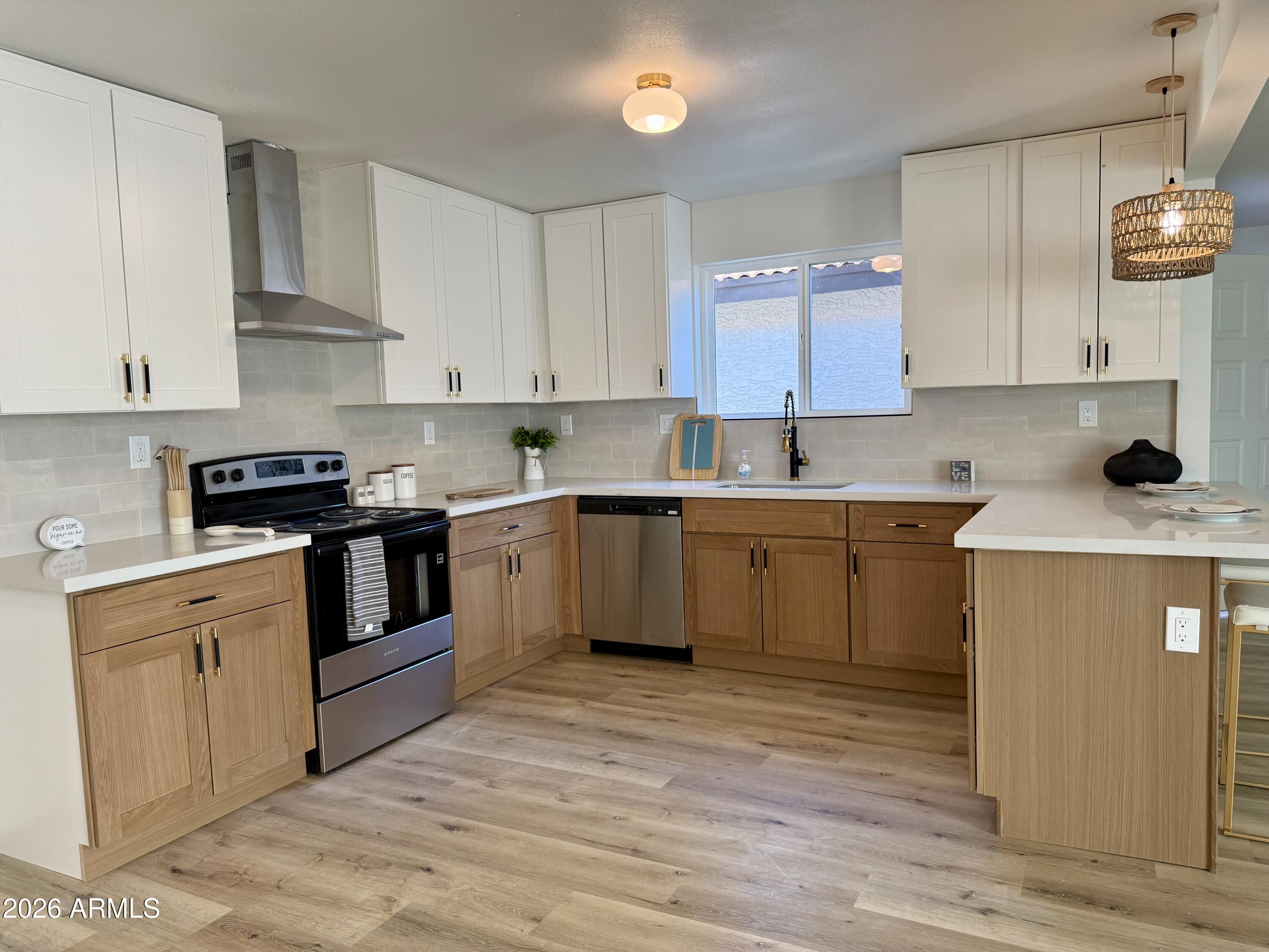 Fully Remodeled 3BR Oasis with Resort Amenities in Sun Lakes

Welcome to this beautifully updated 3-bedroom residence, perfectly situated on an expansive lot in the highly desirable Cottonwood community of Sun Lakes. This turn-key home has been completely reimagined with brand-new flooring, fresh interior paint, updated baseboards, modern hardware, and upgraded lighting throughout. The fully remodeled kitchen is a chef's dream, featuring quartz countertops, a modern tile backsplash, brand-new appliances, and sleek, new soft-close cabinetry.

The primary suite serves as a tasteful retreat showcasing a large custom-tiled shower, his and her vanity, while the guest bathroom is equally remodeled. A versatile third bedroom easily flexes as a den or home office. Step through the large sunroom and sliding door to  to a large patio surrounded by lush roses and a mature lemon tree. Enjoy incredible energy efficiency and low utility bills thanks to  brand-new dual-pane windows througout, and solar panels.

Beyond the home, enjoy a premier resort lifestyle with access to the community clubhouse, fitness center, pools, jacuzzis, tennis and pickleball courts, championship golf courses, and peaceful fishing lakes. Don't miss this rare opportunity!