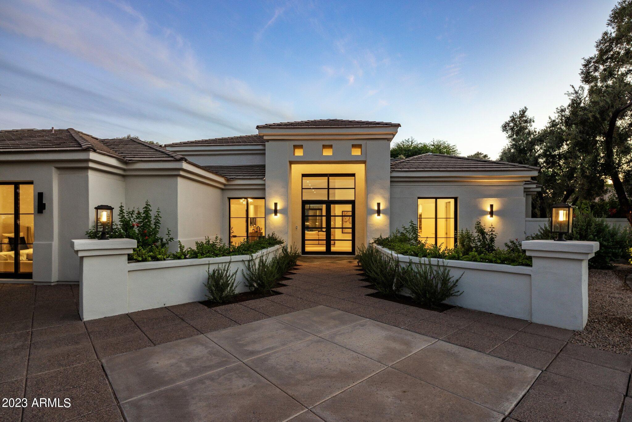 Nestled within one of the most prestigious and highly coveted Paradise Valley guard-gated communities, this newly completed remodel is a single-level gem in Cheney Estates. Its exquisite designer touches and soaring ceilings are an absolute must-see! Imbued with timeless elegance, the interiors seamlessly embrace Arizona's indoor/outdoor living. The dream kitchen features not one, but two large islands, adorned with top-of-the-line Sub-Zero/Wolf and Miele appliances and quartzite countertops.  The master bedroom suite has separate lavish his and hers closets. The revamped backyard has been transformed into a low-maintenance lush green oasis, complete with a private ramada, BBQ & pizza oven cooking area and an intimate jacuzzi/soaking  pool. Currently the best value in PV under 5 million.