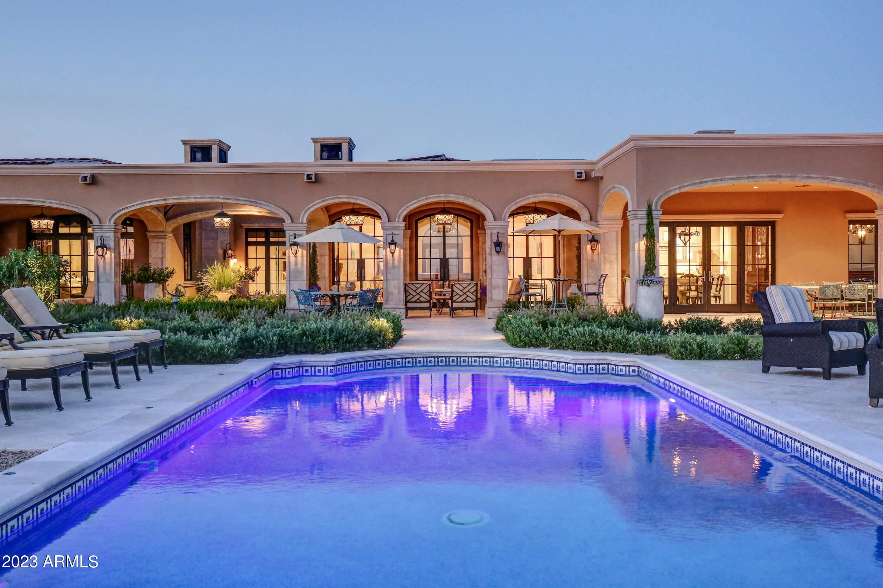 Spectacular Desert Mountain Estate with Golf Membership immediately available. Located in Apache Peak Preserve on 2+ private acres.  Nestled among ancient rock formations. Amazing year-round Valley, sunset and city lights views! Ultimate curb appeal with gated porte-cochere and circular auto court. Magnificent  gardens encompass colonnaded patios, ramada and spa deck. This single level  home is a collaborative effort of 4 ''Masters of the Southwest'' for interior and exterior design, construction and landscape. Expertly curated fixtures, finishes, appliances, and smart home technology. 30-day membership application and approval process. The bridge and gated entry are just the beginning of the dramatic approach, enhanced by.gas lanterns, a bubbling fountain and circular auto court flanked by two garages housing 4 cars total. All leading to the entry courtyard with cozy hearthside seating and seasonal gardens

The stunning great room features high ceilings, a deep crown moulding accented with clerestory windows, a grand marble hearth and a bank of European French doors all opening to the colonaded veranda and Valley views. The formal dining room is appointed with built-in, lighted display cabinets and a show-stopping double wine cellar symmetrically flanking the room. A Chef's Kitchen boasts beautiful white cabinetry with lighted displays, a double island, quartzite counters, ideal cooking layout, large pantry and commercial walk-in cooler. Elegant executive library features coffered ceilings and custom built-ins. Finely appointed Primary Bedroom and Spa Bath with marble counters and custom Italian tiles.

Family and friends readily gravitate to the roomy yet cozy billiards/media room immediately accessible from the kitchen and patio/pool, complete with mixologist's outfitted serving bar. Guest suites and Casita are spacious and appointed in Chateau-Relais style.

The stunning veranda, pool, gazebo and gardens are reminiscent of a Cap Ferret holiday setting, all overlooking unencumbered views of the Valley of the Sun. A generous artist's studio with French windows for natural light is tucked away below the Casita...perfect also as a music studio. It is accessed by an elevator.

Separate patio for furry friends is complete with grass, rose garden  and a potted kumquat orchard!

European-inspired stone fire places are found throughout the exterior courtyards, Great Room, Primary Bedroom and Casita. White oak and marble flooring, European tiles, banks of French doors, impressive mouldings, and elegant fixtures are distinctive features that set this home apart. Smart home features include Savant System and an extensive solar panel array.

Plan soon for a private visit of this masterpiece: imagined by the owners in collaboration with Candelaria Design, Manship Builders, Ashley P Design Interiors and Enchanted Gardens.

Golf membership available through application to the Club.  Purchased from the Club through Escrow. Allow for a 30-day approval process with the Club membership office.