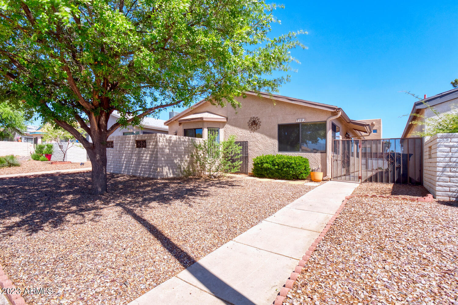 Super cute 3 bedroom 2.5 bath home in the Desert Shadows subdivision. This clean little home has everything you could want or need.  Tile/laminate flooring and ceiling fans throughout.  Nice open kitchen with gas stove, pantry, laundry, and a dining area that has access to a front secluded patio.  There's also another patio right off the master bedroom with artifical turf. This property is ''one of a kind'' in this subdivision as it offers a full 2 car garage with plenty of electrical outlets AND 1/2 bath!!  The subdivision has a beautfully maintained park with swimming pool.  This one won't last long!  Call today to view.