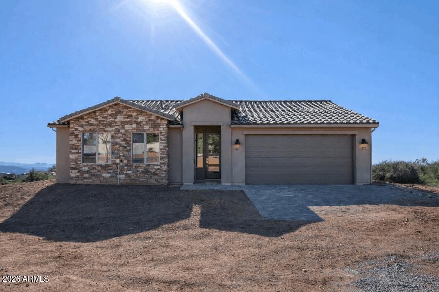 Brand-New Build on over an acre! Open concept design with a split floor plan for maximum privacy. You'll find 3 spacious bedrooms and 2 modern bathrooms, perfect for comfortable living. Large kitchen, boasting 6x36 tile floors, granite countertops, and stainless steel appliances. The expansive kitchen island offers ample space for meal prep and entertaining. The master suite is a true retreat with a generously sized tiled shower, stunning granite countertops, and a large walk-in closet. The home also includes spray foam insulation, enhancing energy efficiency. Outside, enjoy serene desert views with breathtaking 360-degree mountain vistas. Sales contract to be on builders contract