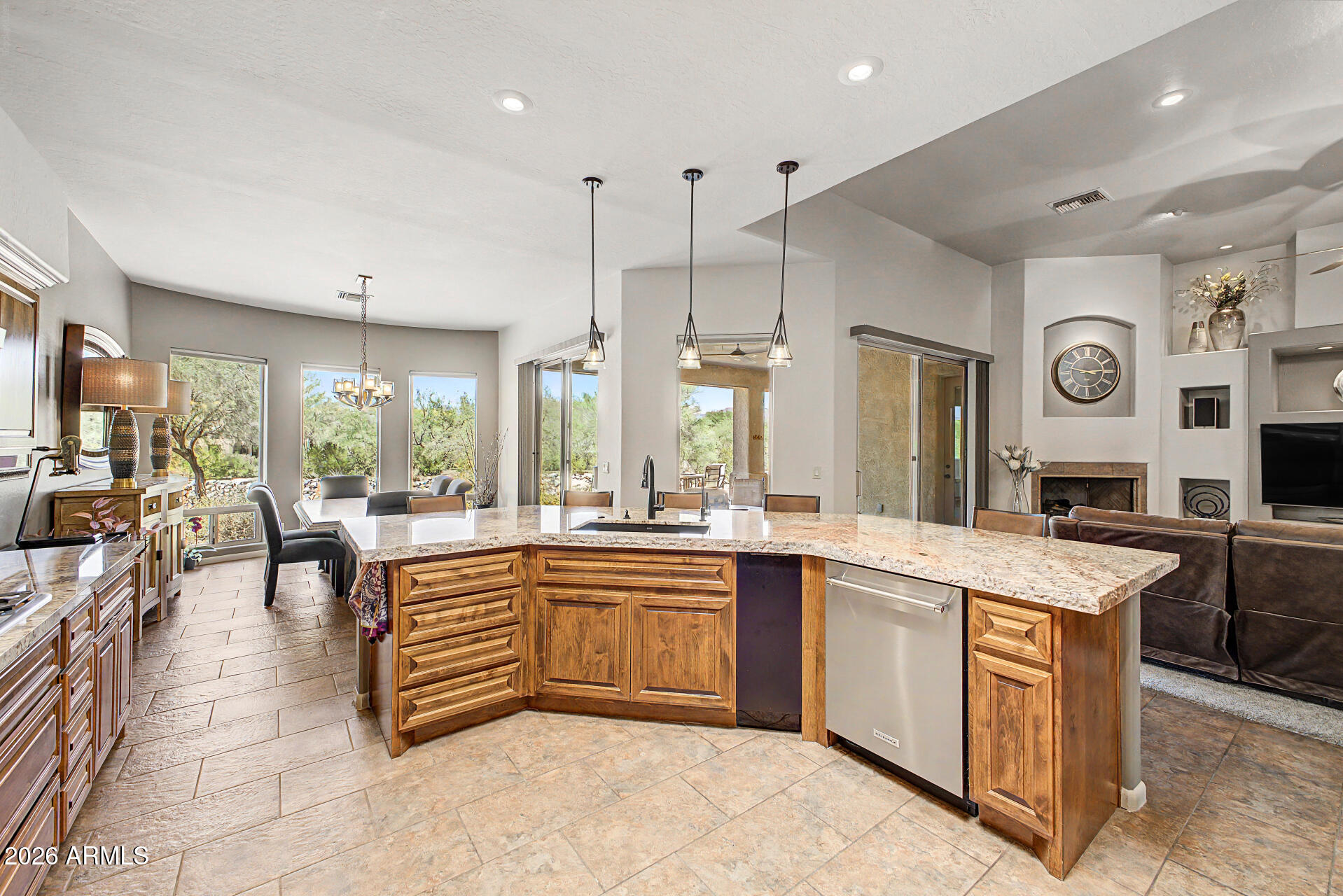 UNITS LIKE THIS DON'T COME ALONG VERY OFTEN. CUSTOM TOWNHOME WITH 3 FULL BATHS, 2 BEDROOMS, PLUS OFFICE WITH MOUNTAIN VIEWS! REMODELED KITCHEN WITH GAS COOKTOP,  TASTFUL GRANITE AT THE DESIGNER HEIGHT, SS APPLIANCES, PORTABLE WINE COOLER, COMPOSITE GRANITE SINK, NEW PENDANT LIGHTS, SKYLIGHT, AND HIGH CEILING. PRIMARY BEDROOM WITH ACCESS TO COVERED PATIO BATH WITH SNAIL SHOWER, SOAKING TUB, WALK-IN CLS FLAT ROOF RECOATED IN 2025, HVAC REPLACED IN 2023, AND 8 FT SOLID WOOD DOORS IN ALL THE RIGHT PLACES. GUEST BEDROOM ENSUITE WITH DOUBLE SINKS & SHOWER + WALK-IN CLOSET. PRIMARY BEDROOM, KITCHEN AND DINING AREA HAVE GREAT MOUNTAIN VIEWS. FAMILY ROOM HAS GAS FIRE PLACE W/SLIDER TO THE PATIO. OFFICE OFF THE FAMILY ROOM HAS DOUBLE DOORS & TWO SKYLIGHTS, UNIT BACKS TO A WASH FOR ADDITIONAL PRIVACY