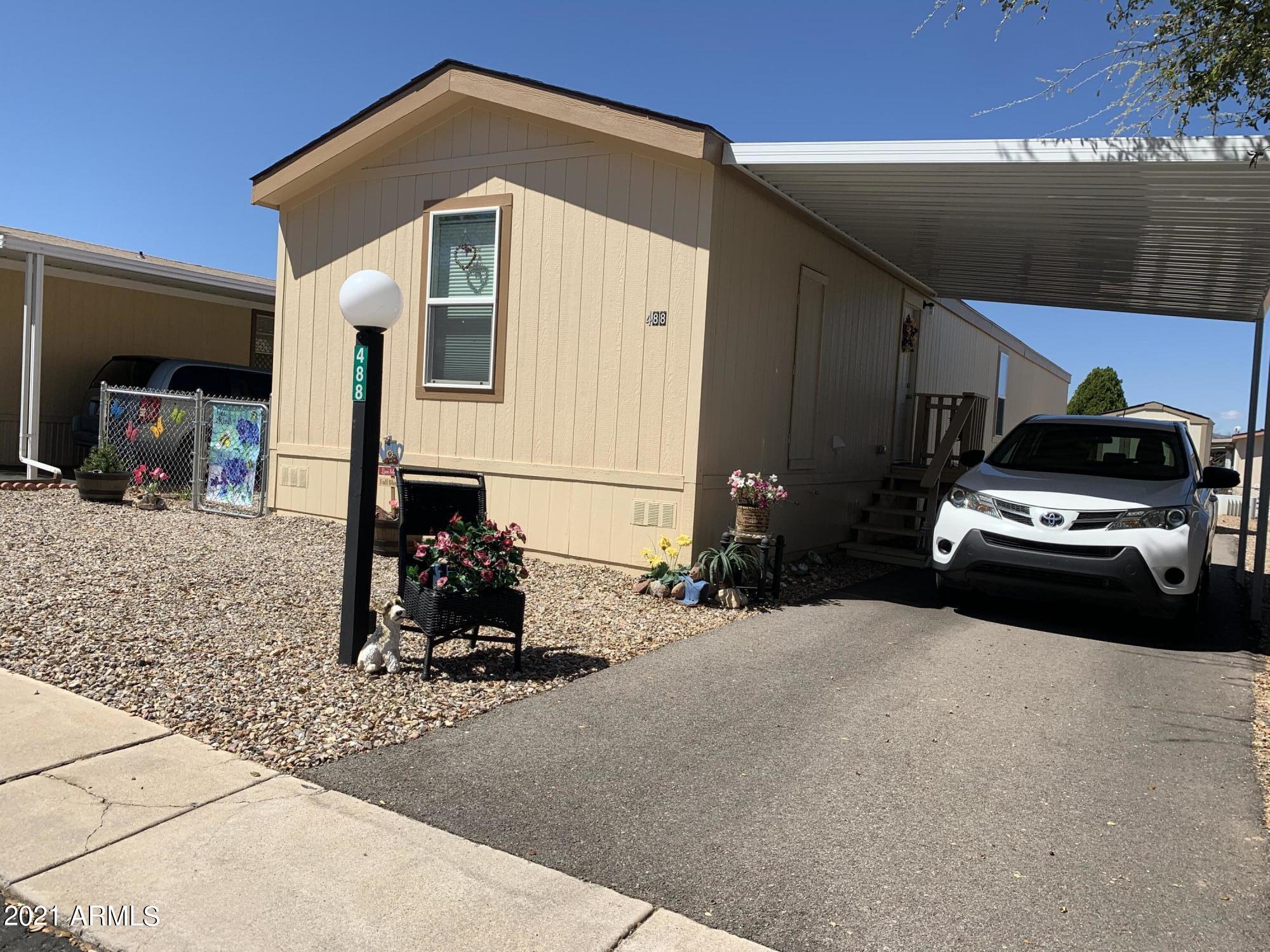 A beautiful single wide completely furnished! All appliances, AC etc are less than 2 yrs old. One owner, with no smoking, no animals. Home is as fresh as the day owner moved in.  Owner has done up grades out side including a great storage shed, beautiful flowers and drip system. There is a covered parking with asphalt paving. There is room for 3-4 cars, depending on size. A monthly park fee of $472.50. Covers Water, Sewer, Garbage Collection & Cable or Satellite. There are two pool, on indoors and one out. There is a play ground and mini golf. There is a creek that runs during rains.