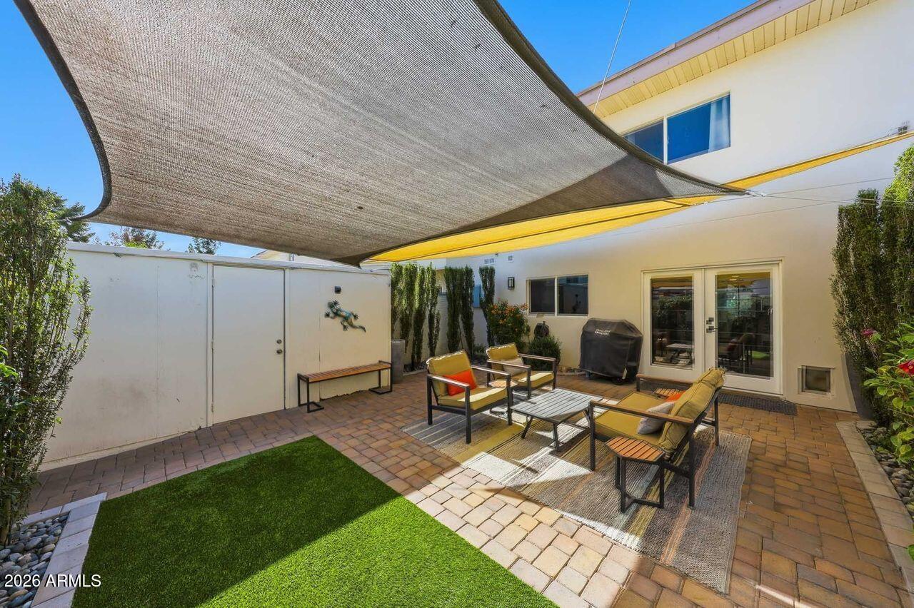 Welcome To Your Remodeled Dream Home in the Heart of Scottsdale! This Professionally Updated Townhouse Offers A Perfect Blend of Modern Comfort and Style. Nestled in a Prime Location Just Steps From the Pool and a Greenbelt Outside Your Front Door! Minutes From the Vibrant Energy of Old Town Scottsdale, This Tranquil Neighborhood is Walking Distance to Chaparral Park with Bike Trails, Lake w Fishing, Tennis, Volleyball, Soccer, Baseball, Basketball, Dog Park, Picnic Areas and Playground Areas. Close to Old Town, 101, Shopping, Restaurants and Talking Stick. Experience Convenience and Luxury Living! As You Step Inside, You're Greeted By A Seamlessly Open Floor Plan That Maximizes Both Space and Functionality. Interior has Been Thoughtfully Updated, Featuring Contemporary Fixtures and Finishes That Elevate the Overall Aesthetics Featuring TONS of Upgrades to Include a Tastefully Redesigned Kitchen With Quartz Countertops, LG Stainless Steel Appliances, Custom Tiled Backsplash, Recessed Lighting T/O, Black Faucets and Hardware, Dining Area, Breakfast Bar, LVP Flooring, Upgraded Carpet, 4" Baseboards, Customized Paint, Ceiling Fans, New French Doors to Patio, Dual Pane Windows, Remodeled Bathrooms and Laundry Room, Oversized Bedrooms w Primary Overlooking HUGE Greenbelt in Front of Home, NEW DAIKIN HVAC UNIT 2025 w/10 Yr Transferrable Warranty, New Sleek and Modern Stair Railing, and Much Much More. Enjoy Your Private Backyard Oasis w Custom Pavers, Synthetic Grass (Installed 6 Mos Ago), Professionally Landscaped w Plants, Drip System, Low Voltage Lighting and Sun Sail Shades Makes It Feel Like a Second Living Space! Located Close to LOOP 101 for Quick Commute Anywhere in the VALLEY. Scottsdale Fashion Square and Old Town Scottsdale Minutes Away! Wonderful School Districts too! This is a Very Quiet Community and it DOES ALLOW SHORT TERM RENTALS!!! LOCATION, LOCATION, LOCATION!
