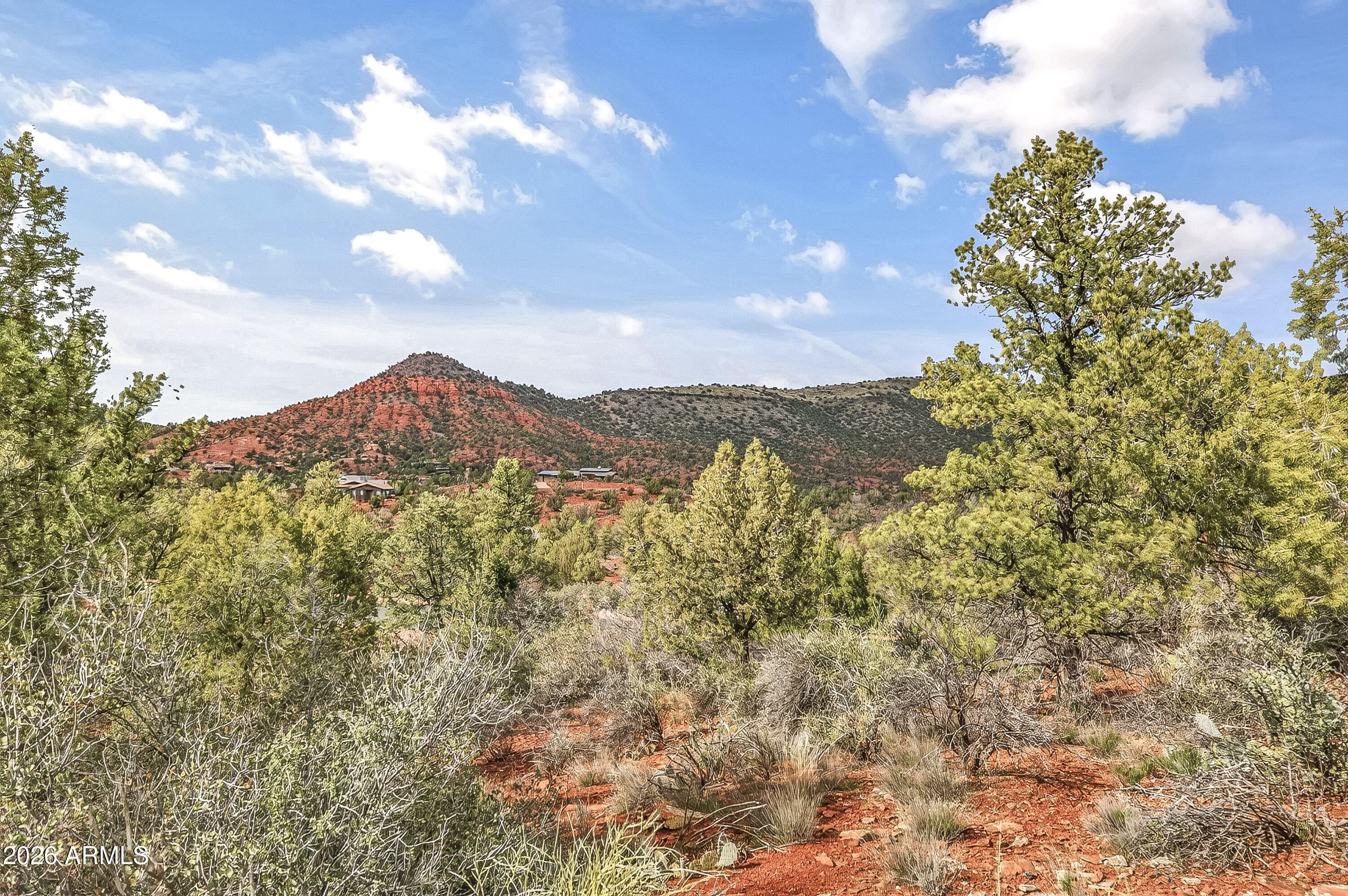 Rare opportunity to own in a gated community in Sedona, AZ. Cross Creek Ranch offers stunning and unspoiled, world-famous red rock views and is surrounded by beautiful custom residences. This unique lot is one of only two in the subdivision with dual building envelopes, providing added flexibility and the possibility of a detached guest house. Enjoy the natural beauty of the area, with community hiking trails and multiple access points to bordering Oak Creek. With a Red Rock State Park Pass, you can use the private gate that accesses the adjacent park for an additional 286 acres of hiking, wildlife, and additional views along Oak Creek.