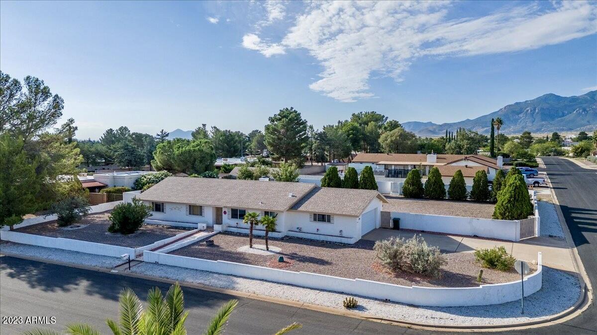 Pride of Ownership Home! Beautiful, updated 3 bedroom, 2 bathroom home that offers a 2.5 car attached garage (don't worry; it can fit your full size lifted truck!). Still need more room? There is a detached single car garage with an additional storage space available in the backyard! This spacious lot, centrally located in town, offers: RV gate, RV parking, mature apple tree, private pool, detached garage, large covered patio that has wonderful mountain views! Inside the home you will find fresh kitchen cabinets, new appliances, recessed lighting, fireplace, updated windows, recently replaced water heater, AC and furnace. No carpet. No HOA. No popcorn ceilings! So much to love! Check out this home; it is ready to be yours!