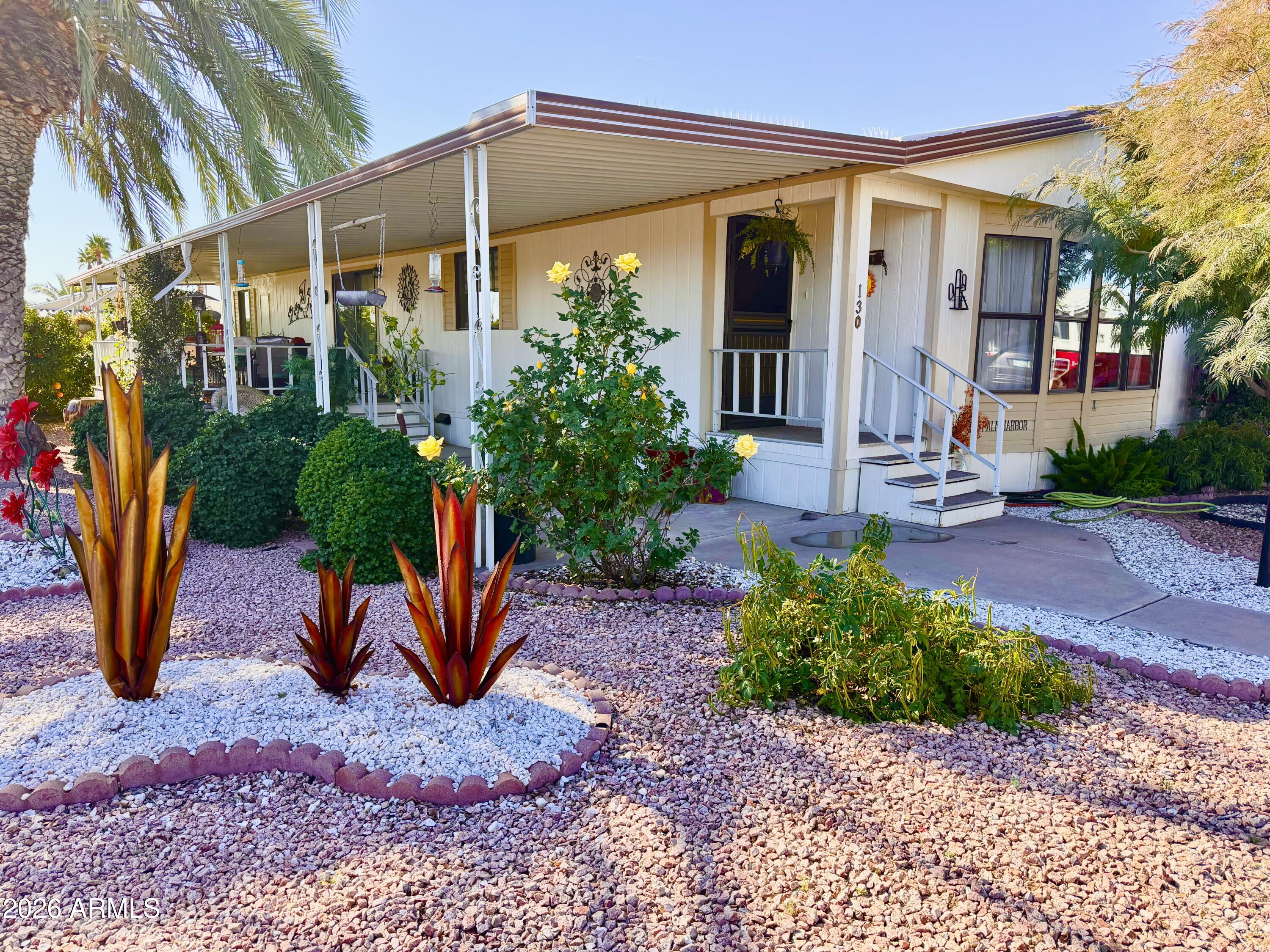 Welcome home to your beautiful oasis in Ellsworth Springs! This custom, fully furnished, double wide, 2 bedroom 2 bath, private corner lot home provides natural landscaping creating a serene, private escape. This exceptionally cared for property includes a new AC unit, updated flooring in the family room, kitchen, dining room and laundry room, as well as an expanded kitchen island with a new, butcher block counter top. With space to park two+ vehicles on the extended covered carport, you can sit back and relax while enjoying a cup of coffee on your quiet, peaceful, large deck or head over to the club house and take a swim in the heated community pool. There are many activities within the community or take a short drive for additional entertainment, shopping and restaurants.