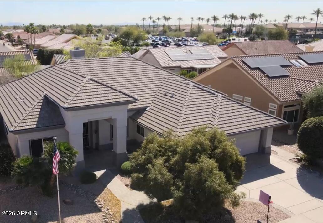 Did you say high ceilings? This 2,656 sq ft Avondale with its grand entrance and 12' ceilings feels like it is so much bigger! Come see the 2 great rooms & the resort style, primary suite! The expansive, light-filled, split floor plan features 2 private bedroom suites, 2.5 baths, & a flexible den/office. The perfect kitchen island  is a central focus surrounded by counters, cabinets, a breakfast bar, nook & 2 generous living areas. The architectural beauty, primary suite has a sitting area & a gorgeously remodeled bathroom - top quality! New roof underlayment, newer HVACs, upgraded paint in & out, a 2.5 car garage, inside laundry, natural gas option & an expanded covered back patio complete this exceptional property on a quiet street, walking distance to Palm Ridge Rec Center pickleball! Recreation Center and premier golf courses, this home places you in the heart of Sun City West's vibrant 55+ lifestyle. Enjoy multiple recreation centers, pools, fitness facilities, pickleball, tennis, clubs, and year-round social activitiesall close to shopping, dining, and medical services. Resort-style living at its finest.